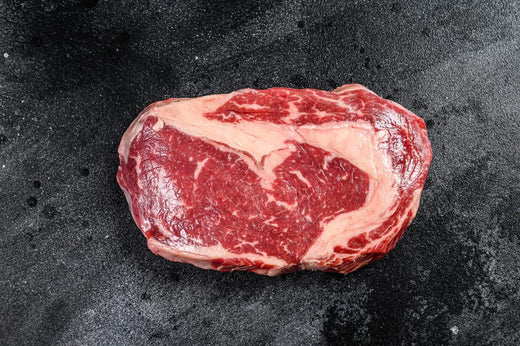 Ribeye steak with rich fat marbling showing high fat content commonly prioritised in a proper carnivore diet.