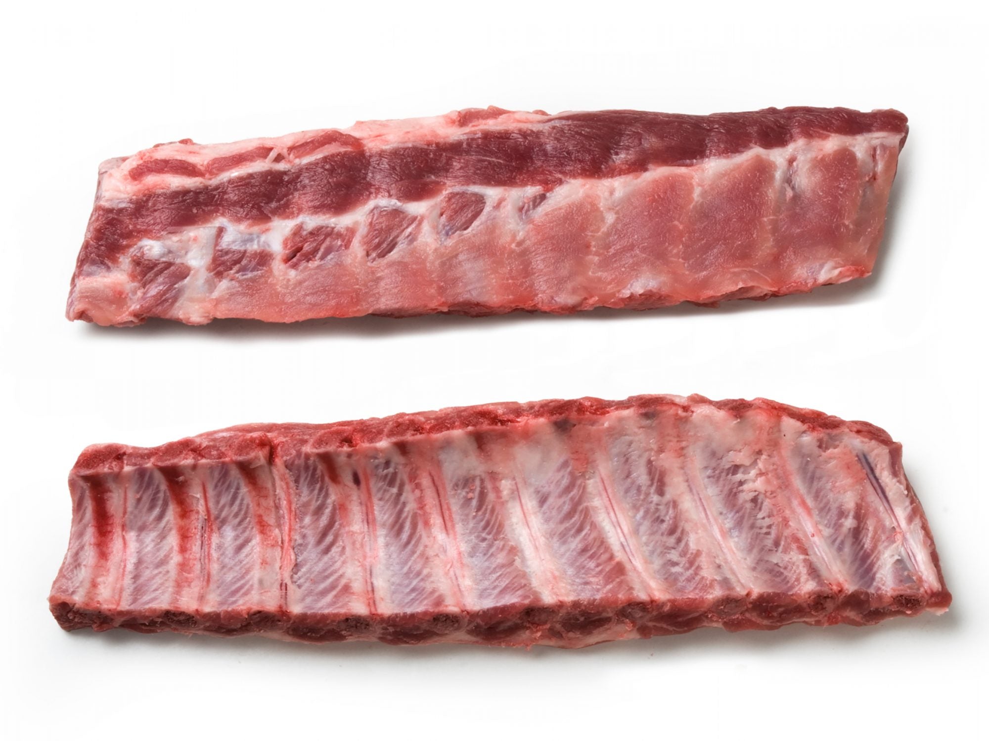 Two uncooked pork rib racks displayed on a white background, one showing the meaty side, the other revealing the rib bones.