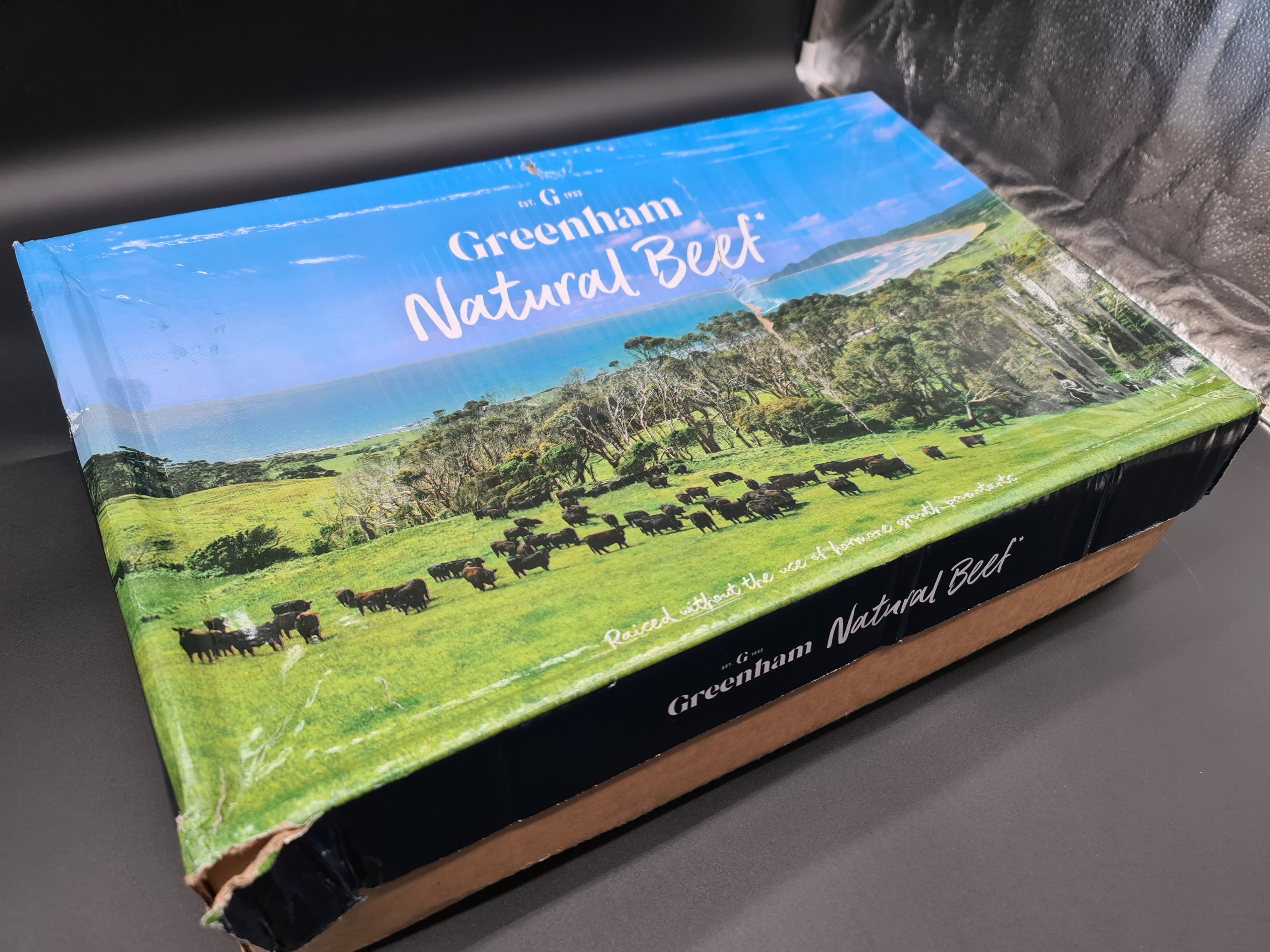 Open Greenham box with vacuum-packed beef cuts inside