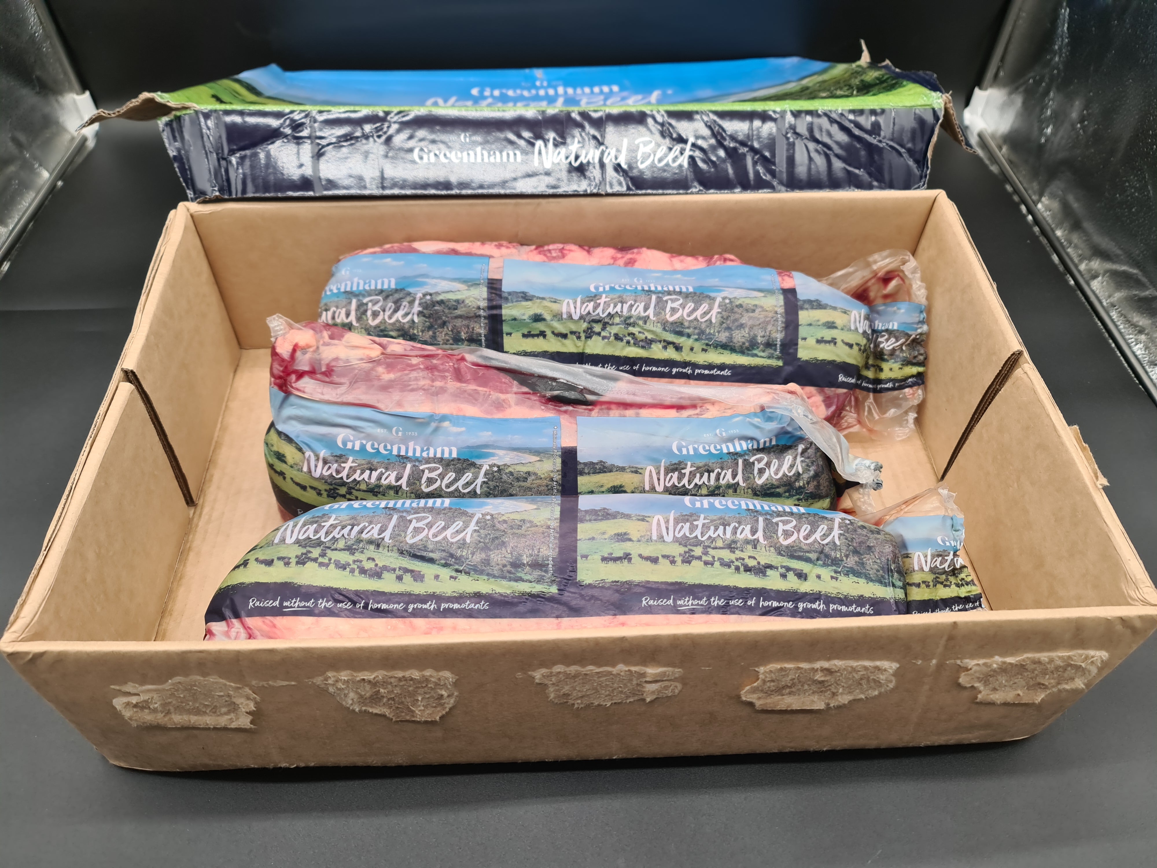 Closed Greenham Natural Beef box on a dark surface