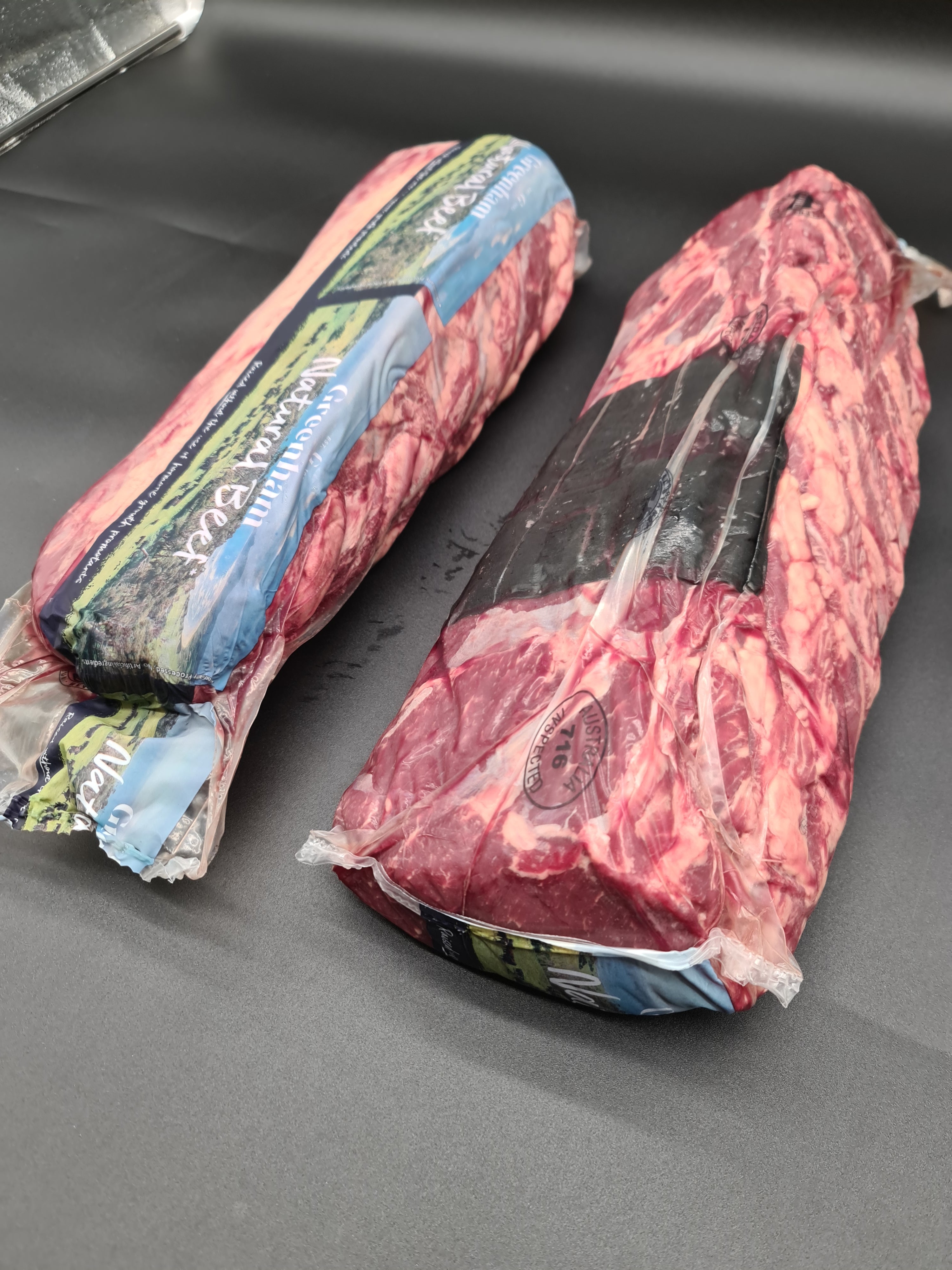 Two Greenham Natural Beef cuts side by side in packaging