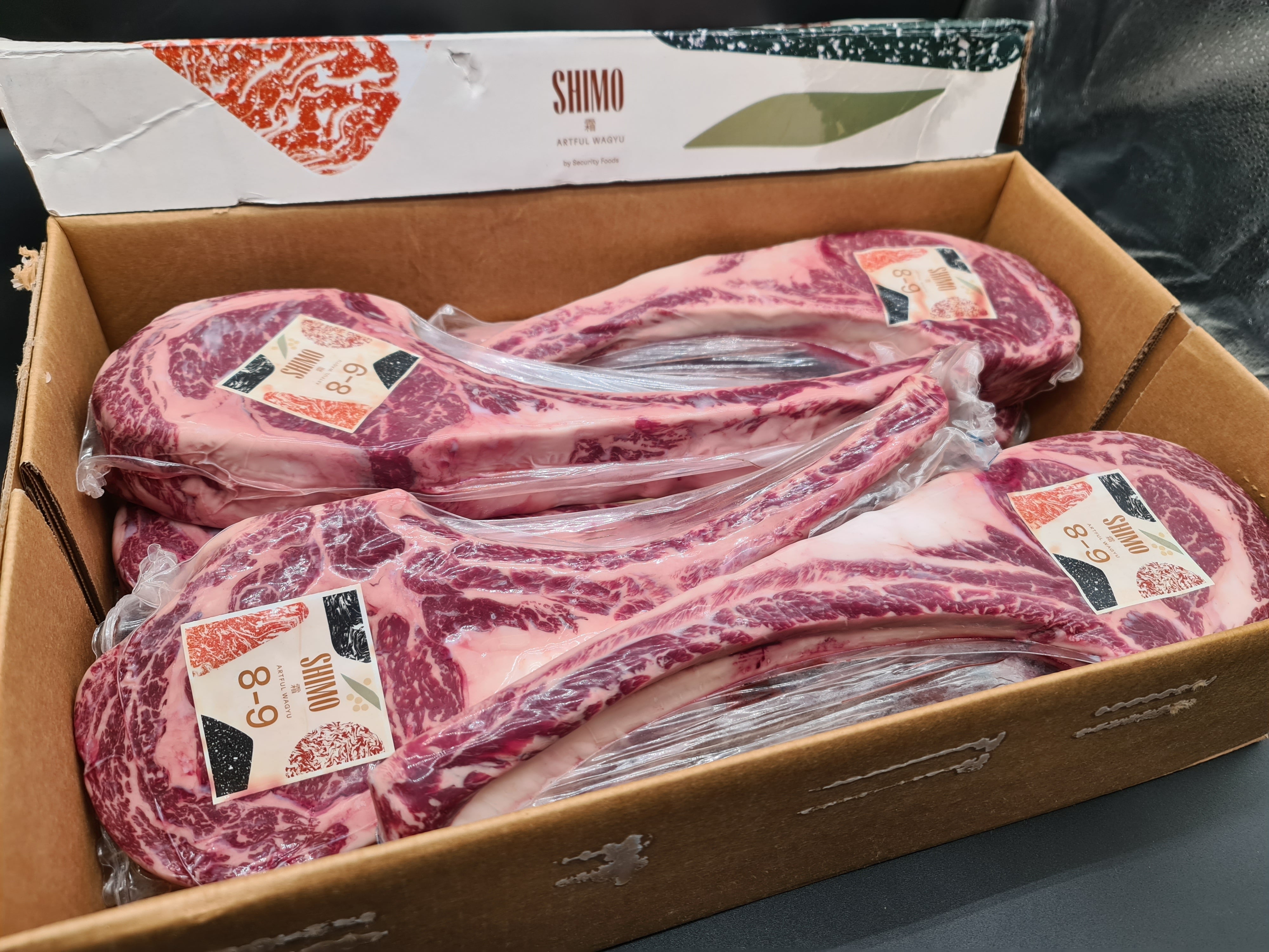 Shimo grain fed Wagyu MB9+ tomahawk rib in vacuum packaging