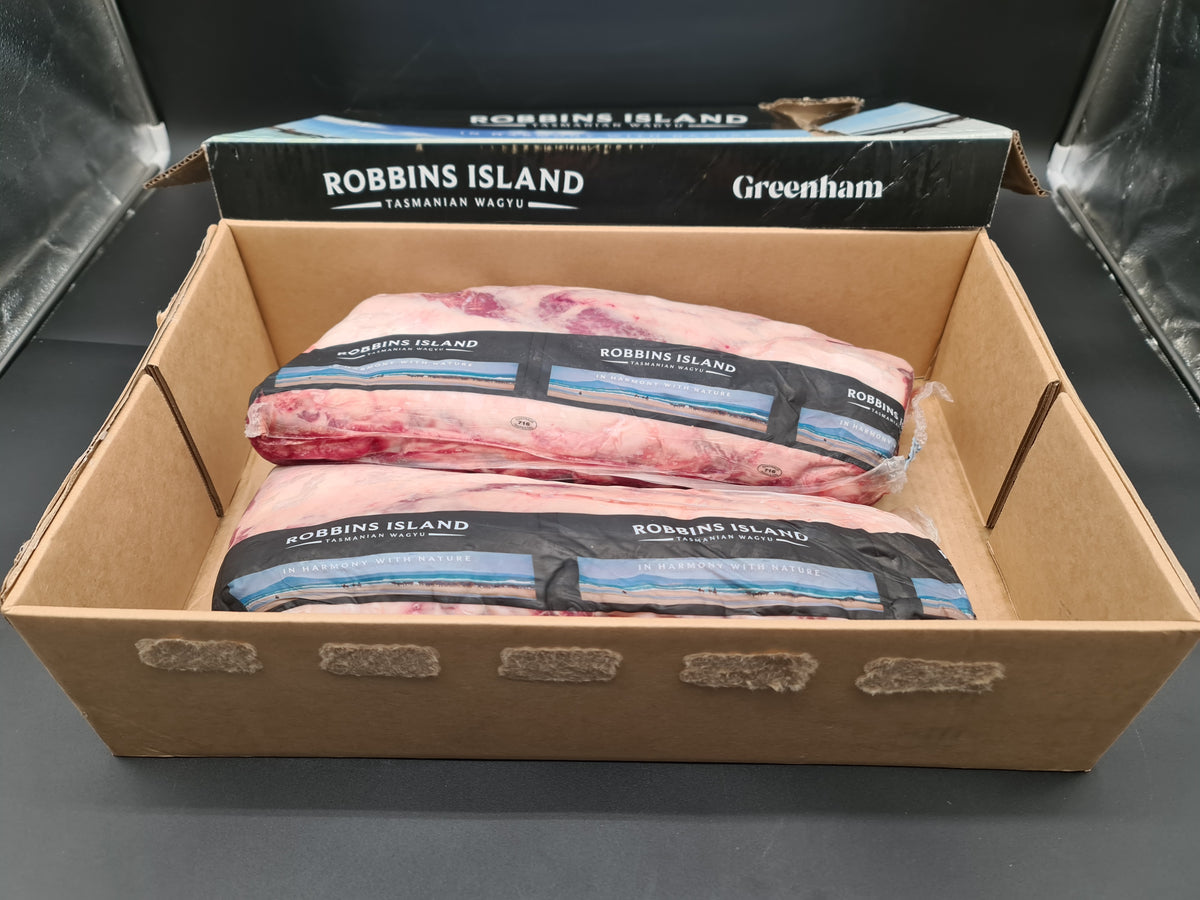 Open premium beef box with vacuum-packed cuts inside