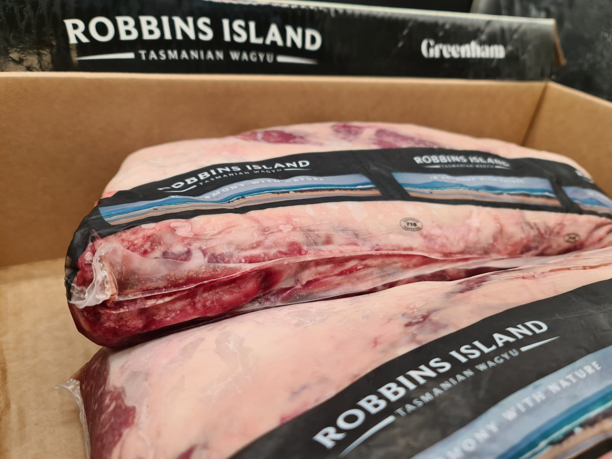 Vacuum-packed premium beef cut on a dark surface