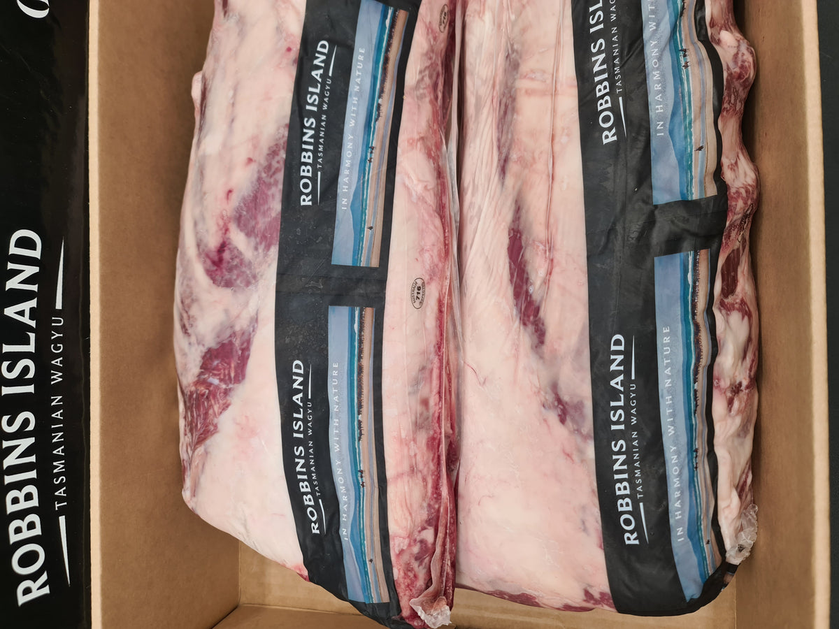 Angled premium beef cut showing lean meat and fat cap
