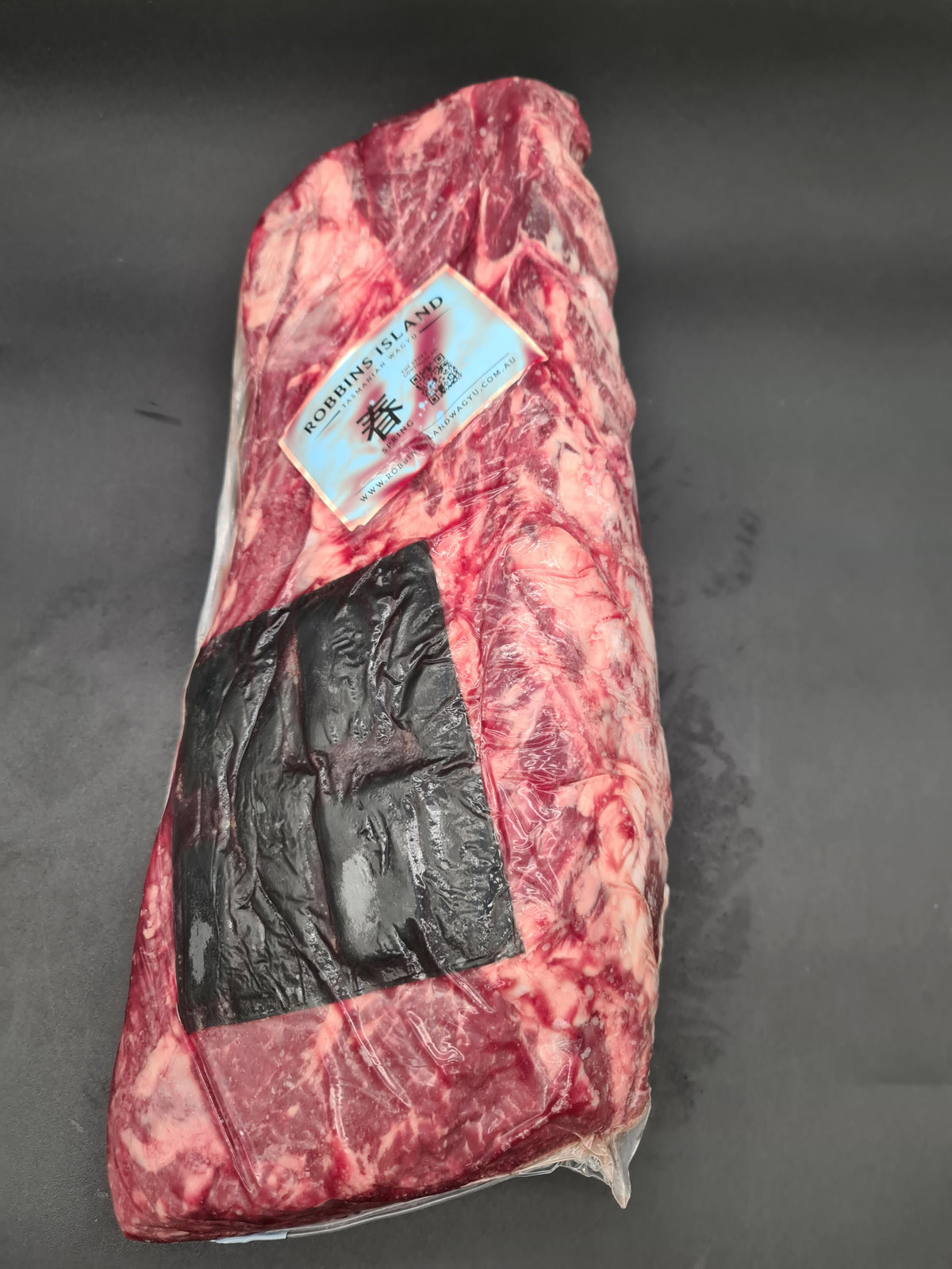 Open box filled with premium vacuum-packed cuts
