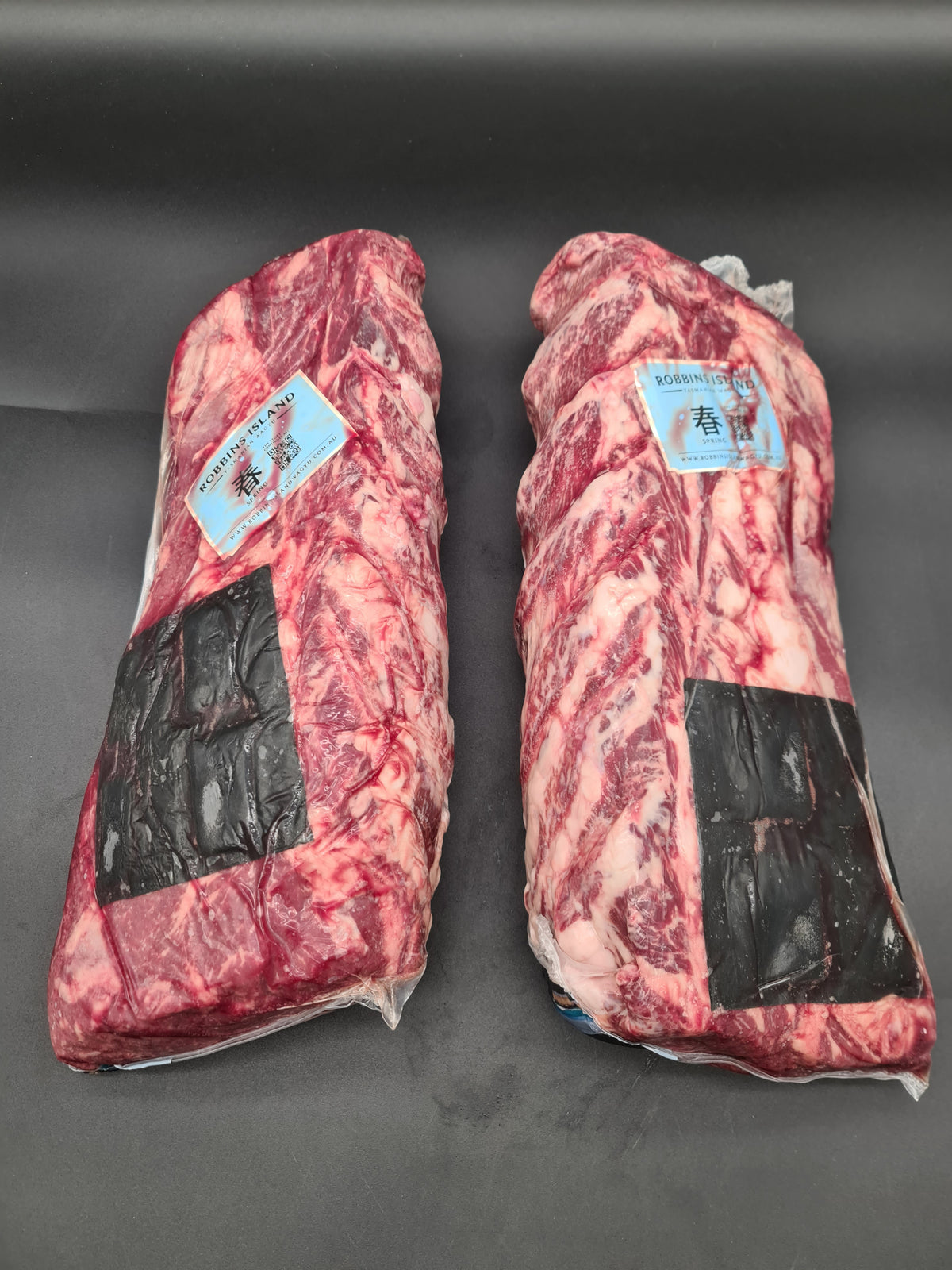 Angled premium beef cut showing lean meat and fat cap