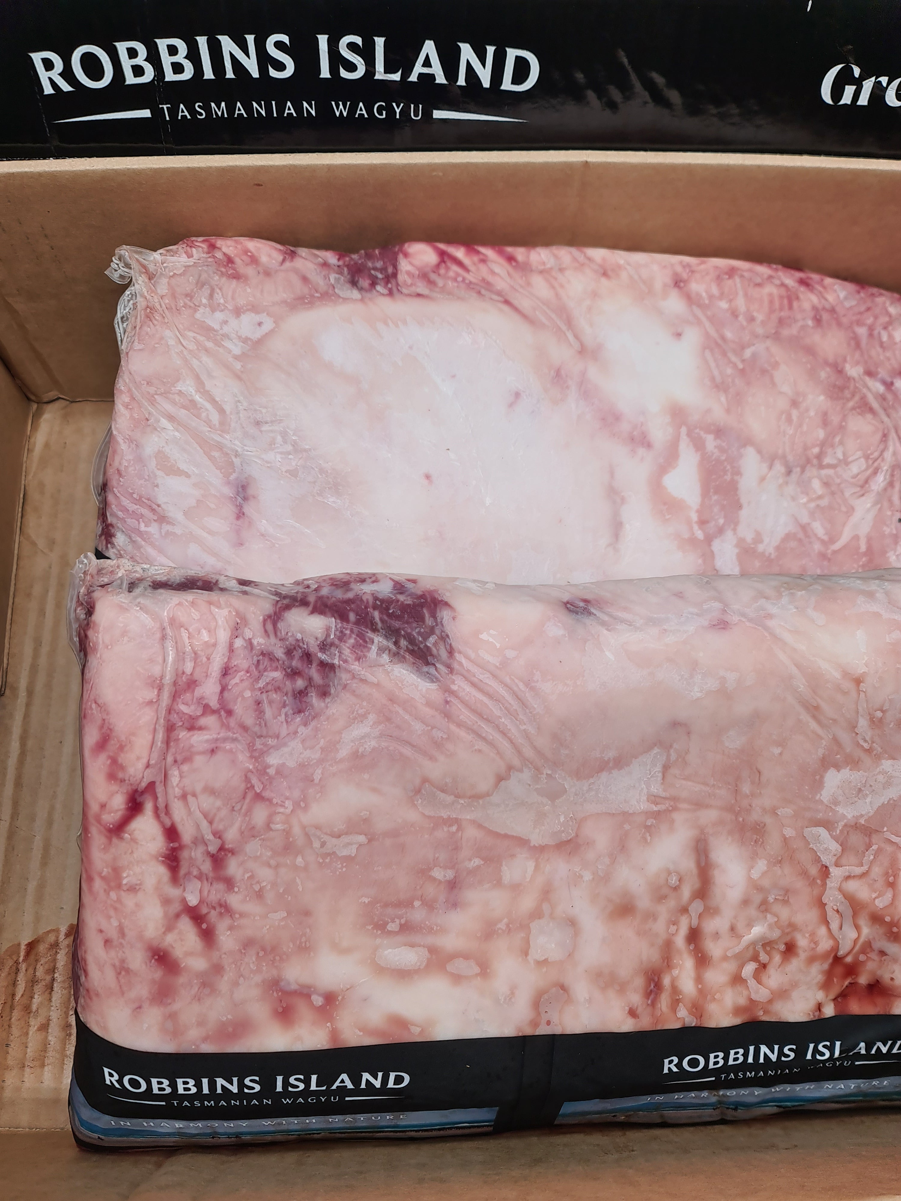 Close-up of premium beef cuts packed in an open box
