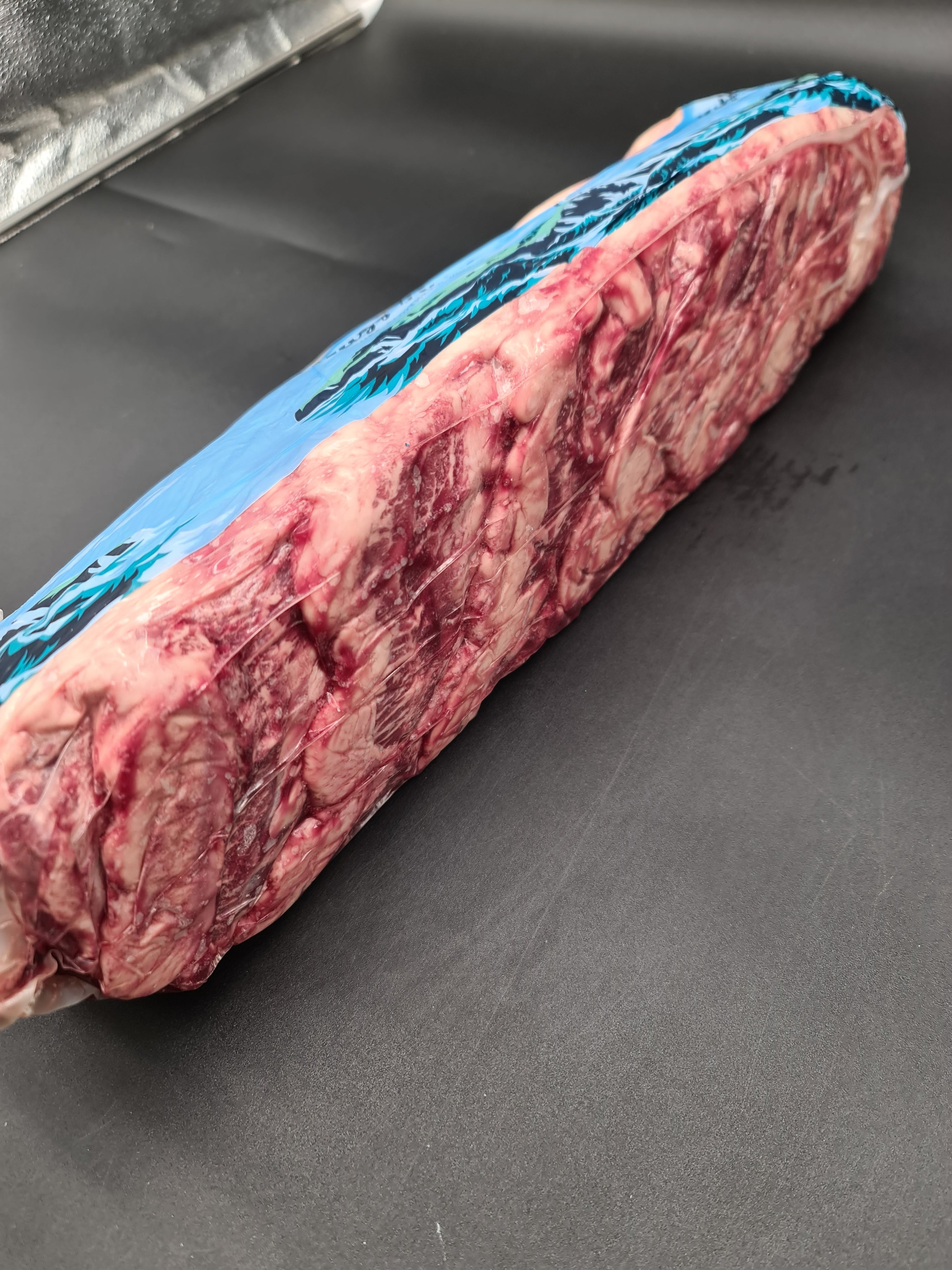 Angled view of packed premium cuts inside an open box