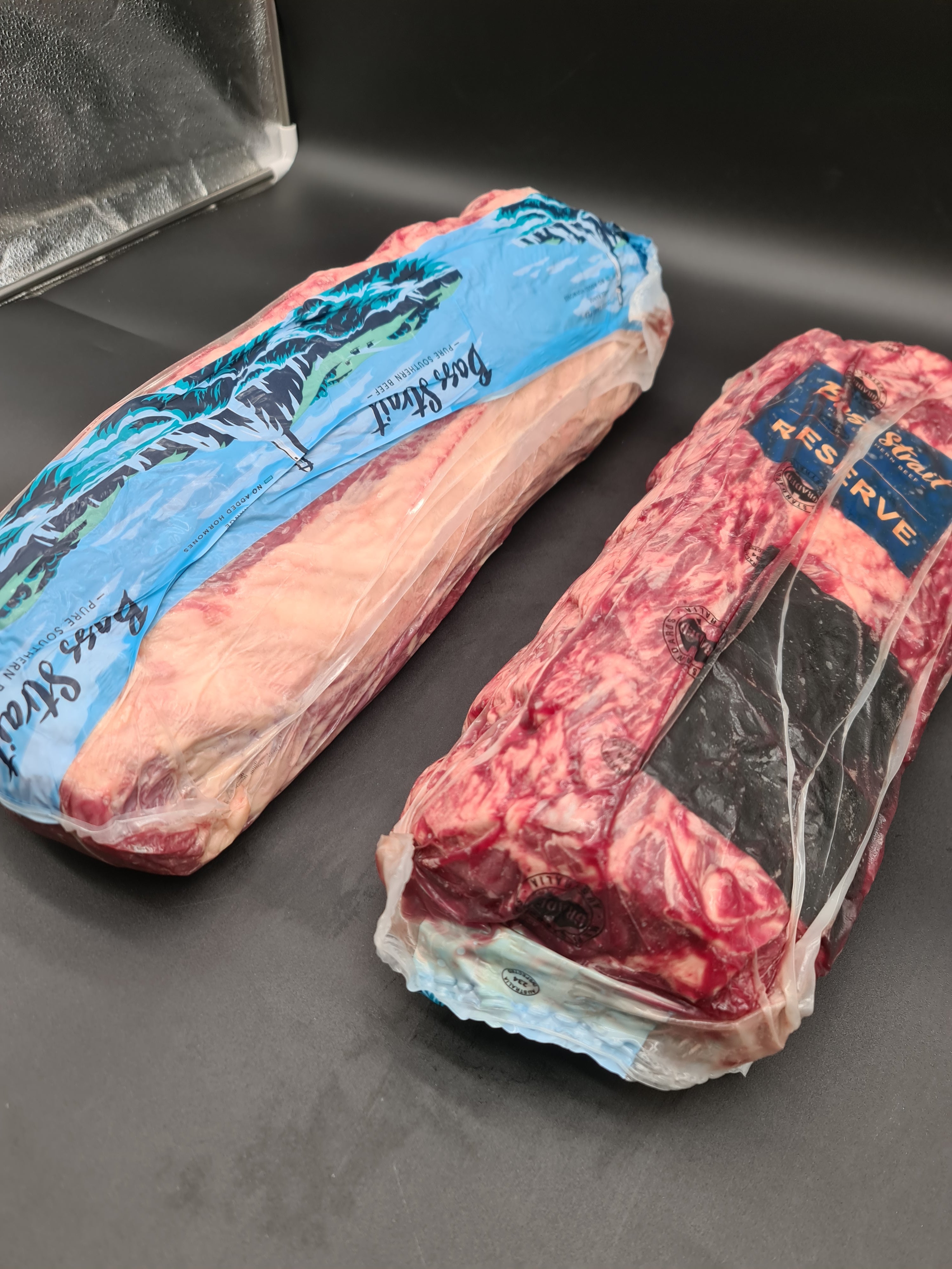 Close-up of premium meat cuts packed in an open box