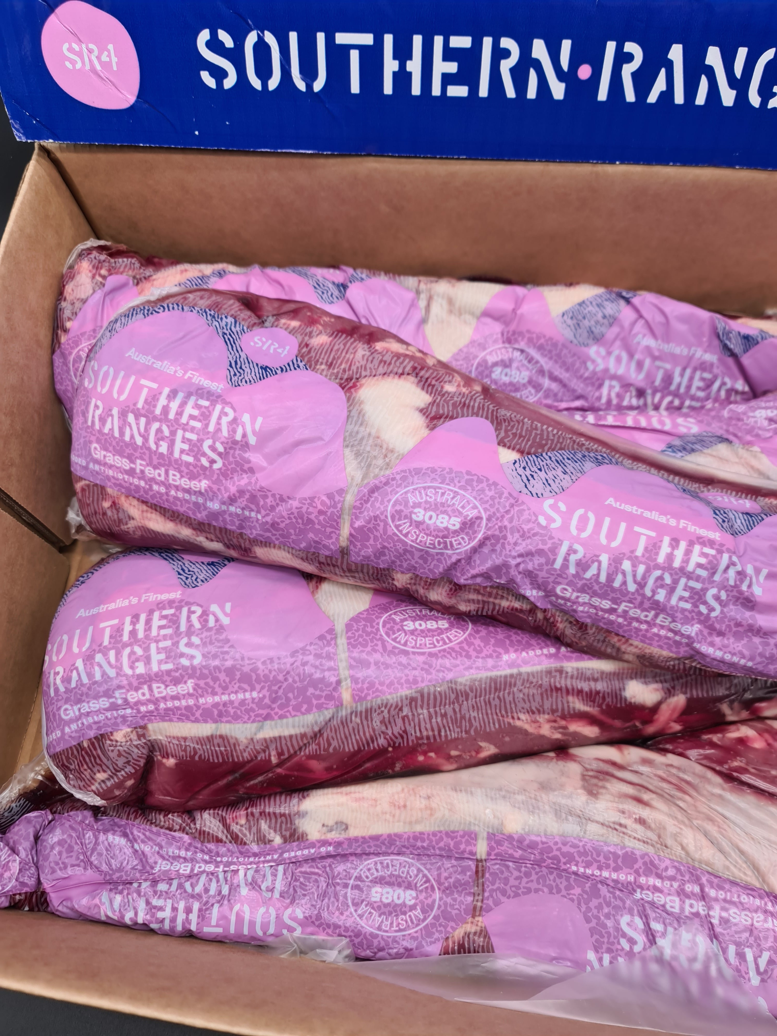 Close-up of premium meat cuts packed in an open box