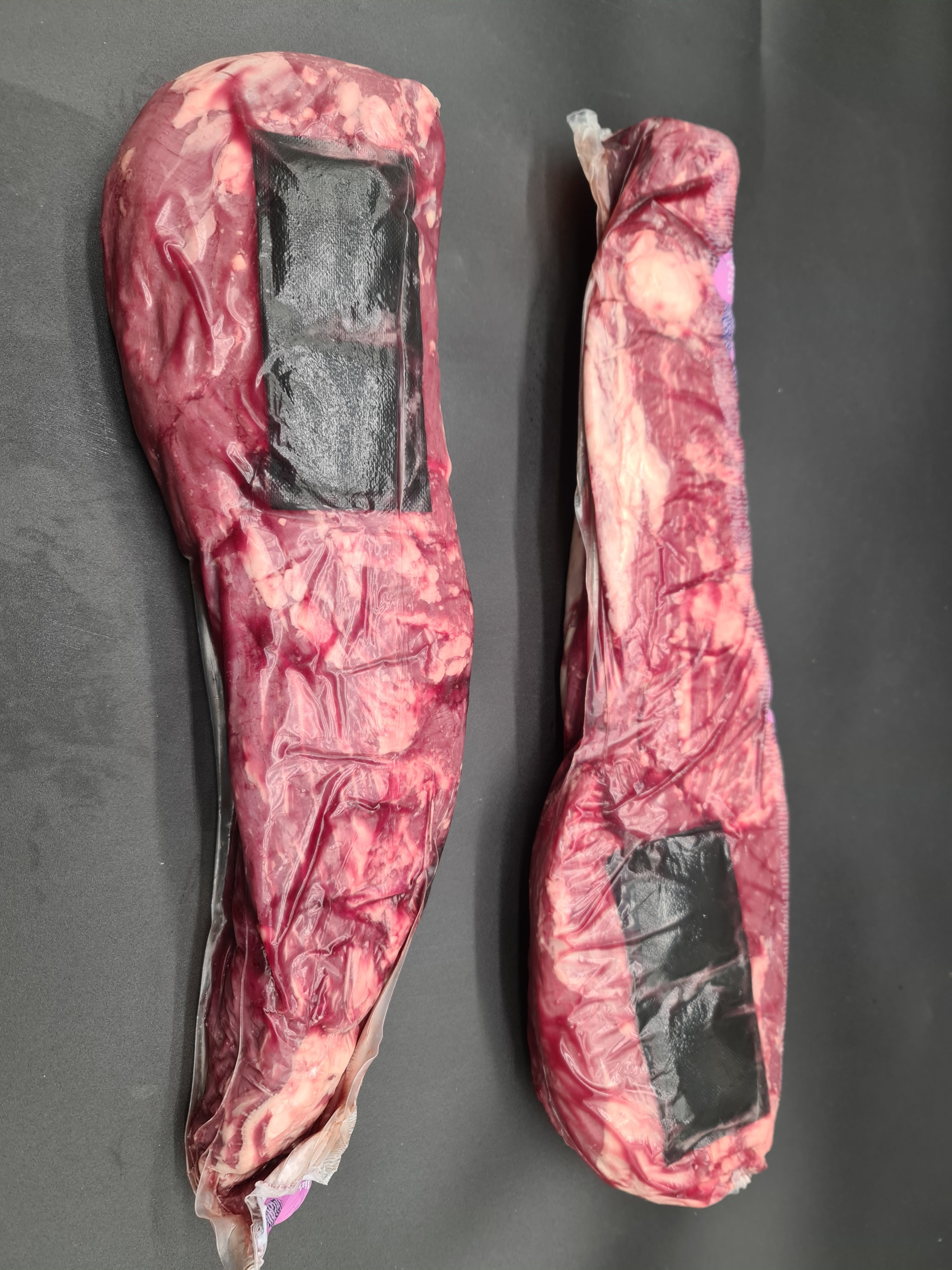 Thin slices of highly marbled Wagyu beef on a serving board