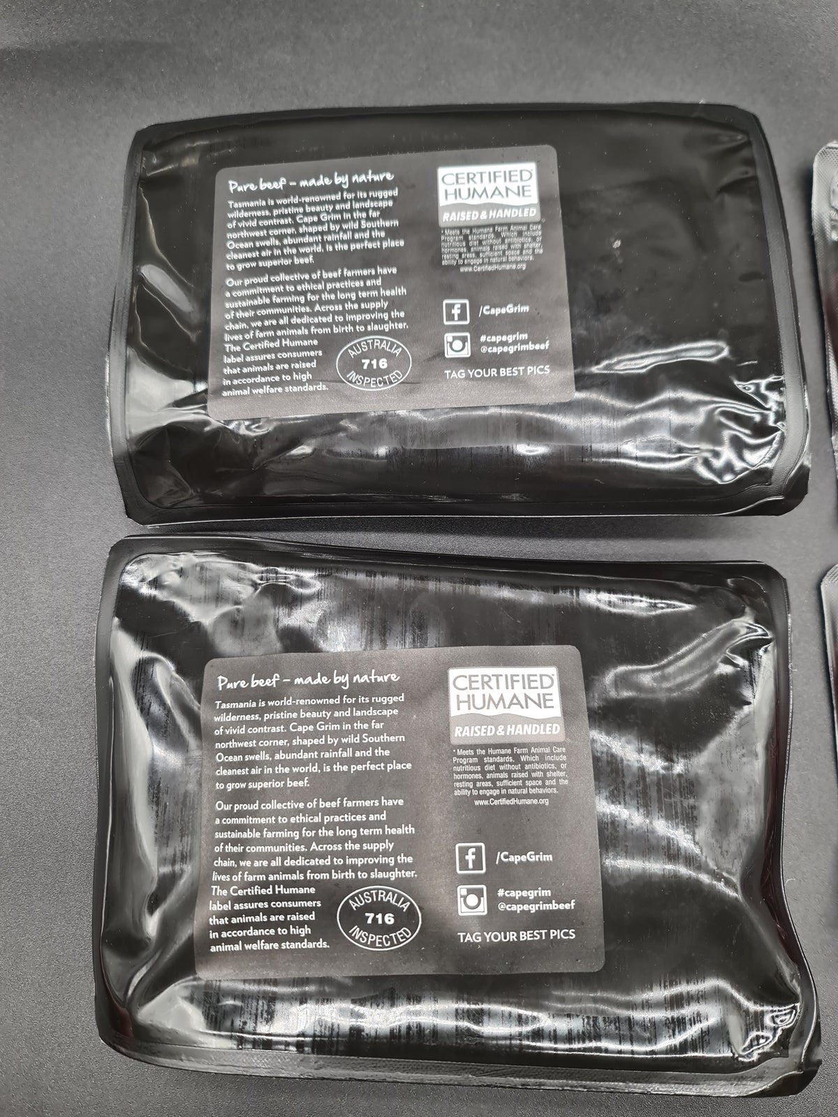 Open premium beef box with vacuum-packed cuts inside