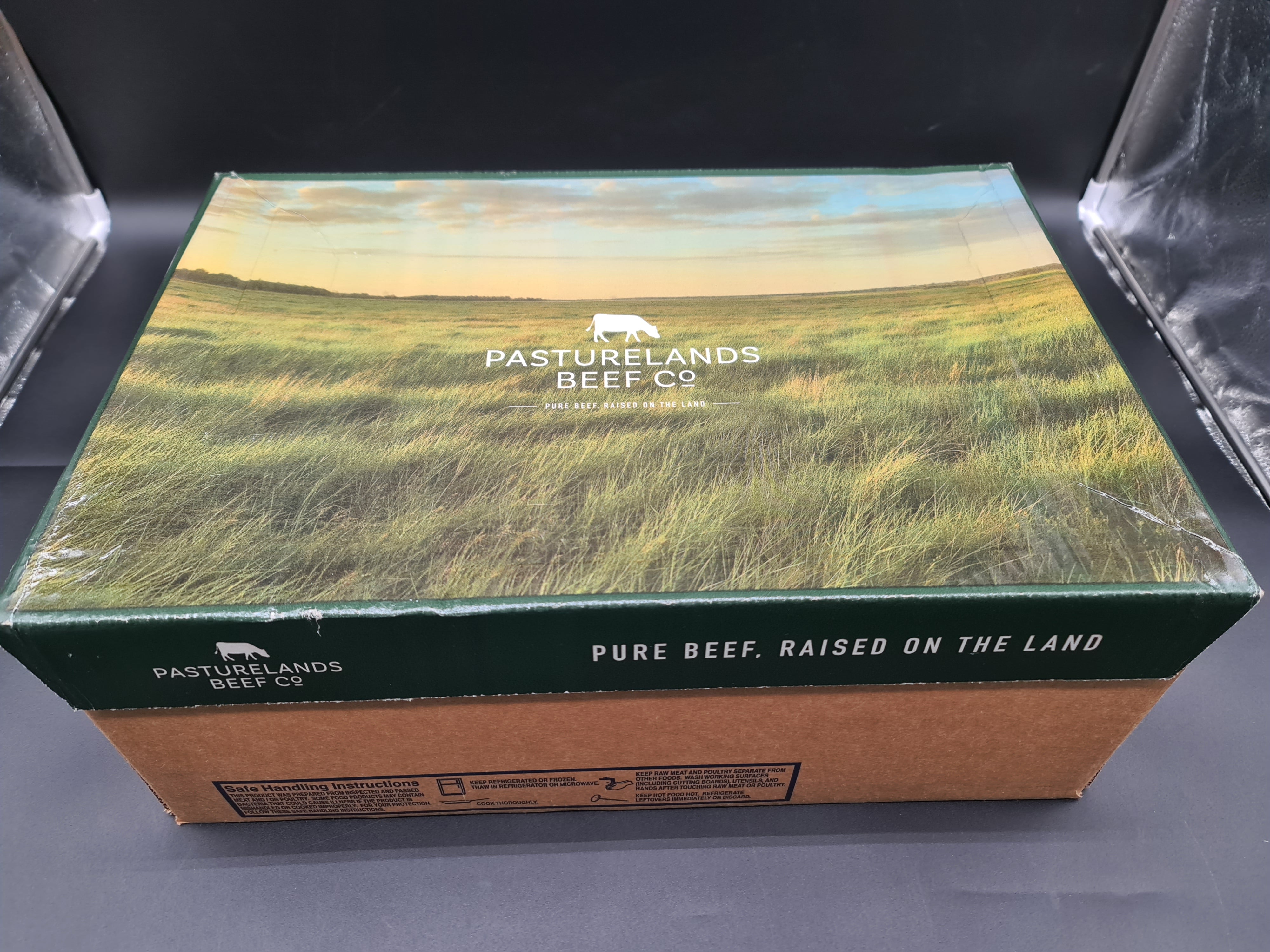 Angled view of premium beef cuts packed in an open box