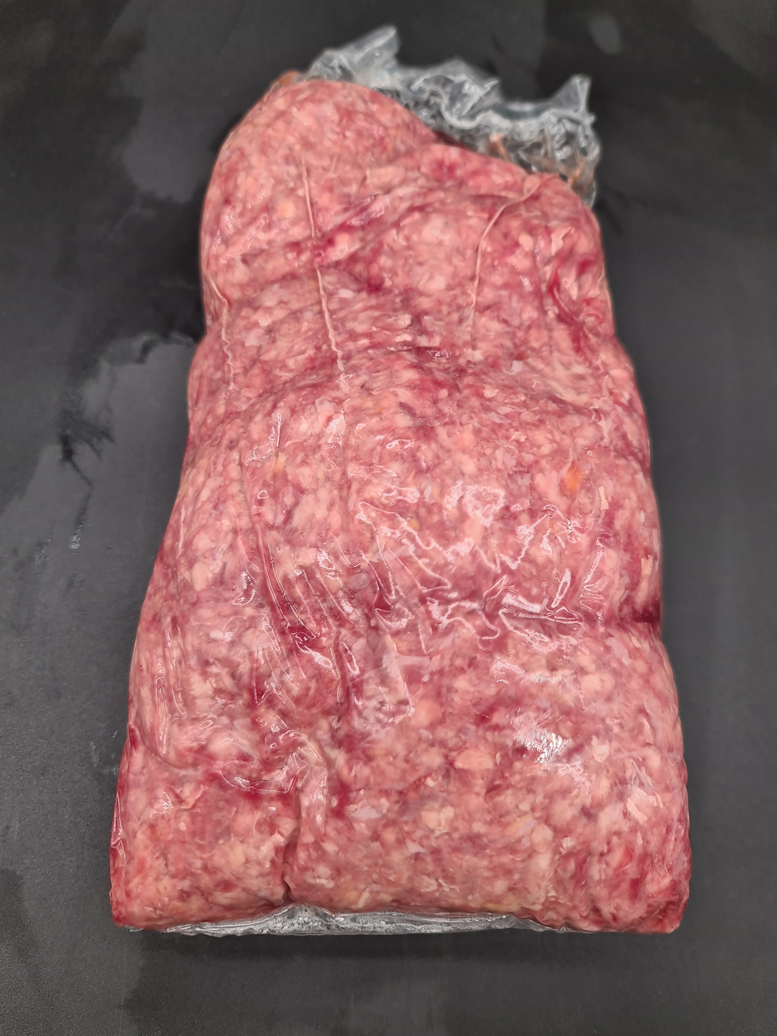 Vacuum-packed premium beef cut with branded wrap