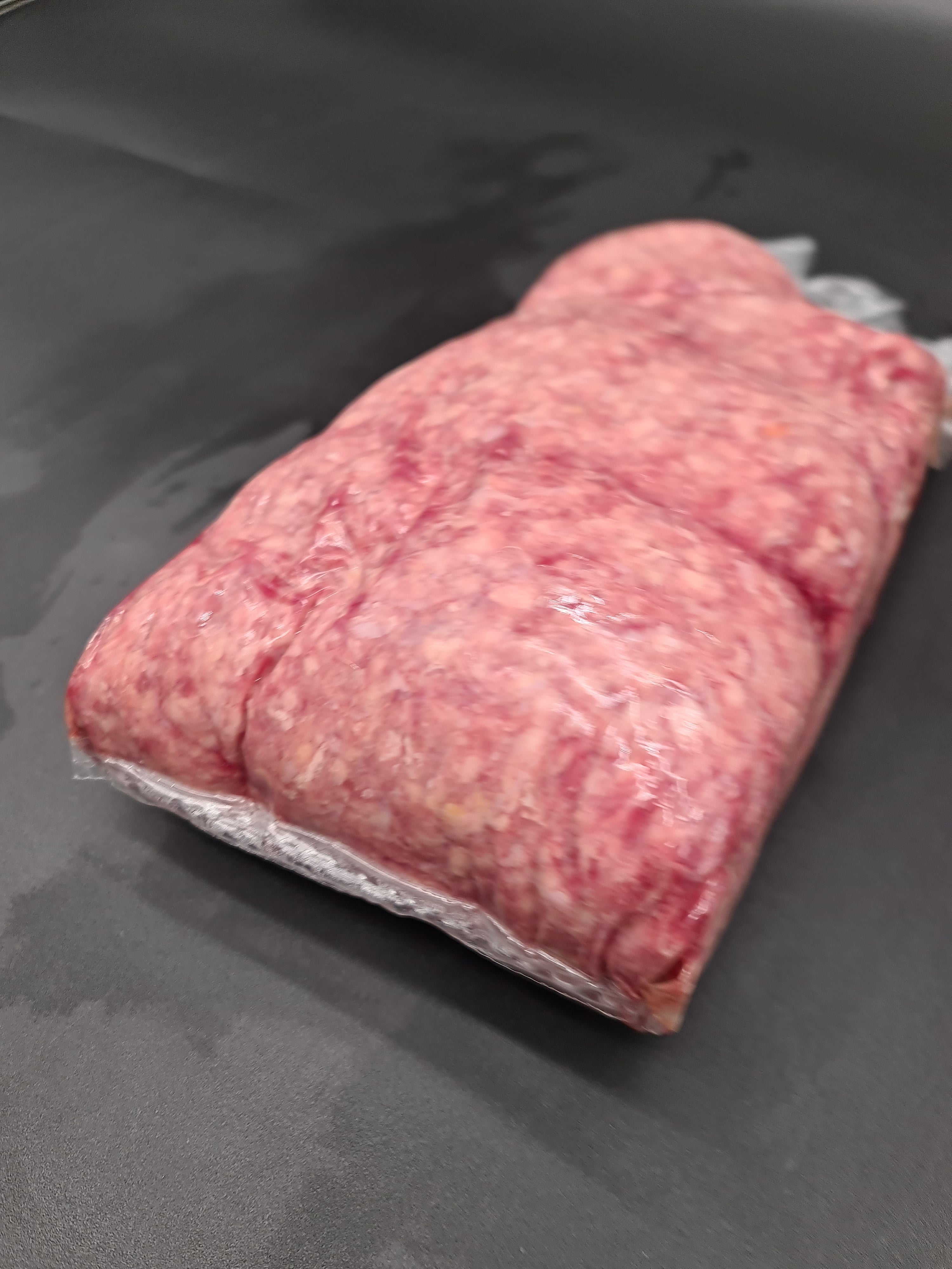 Angled premium beef cut showing lean meat and fat cap