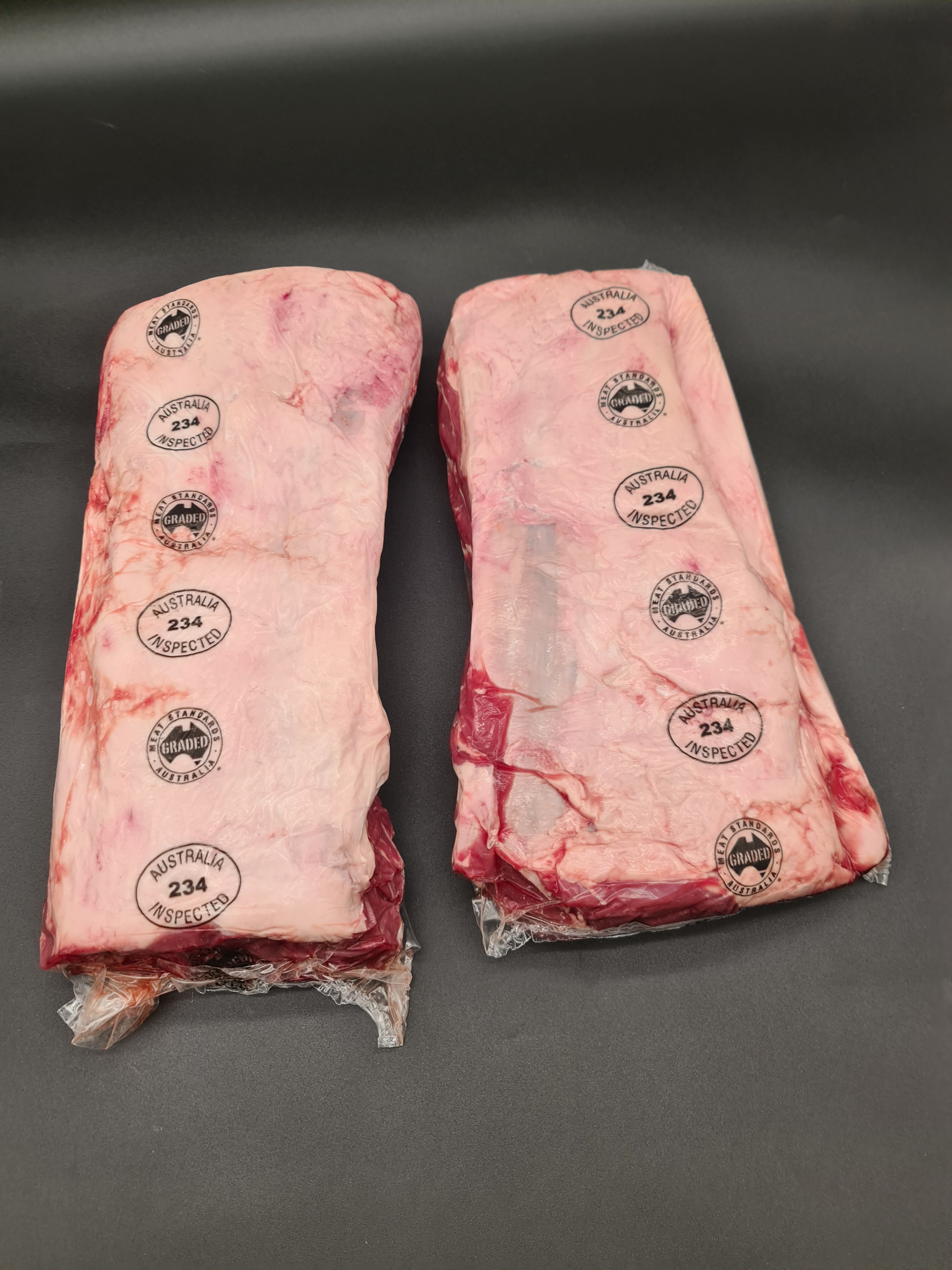 Close-up of premium meat cuts inside an open box