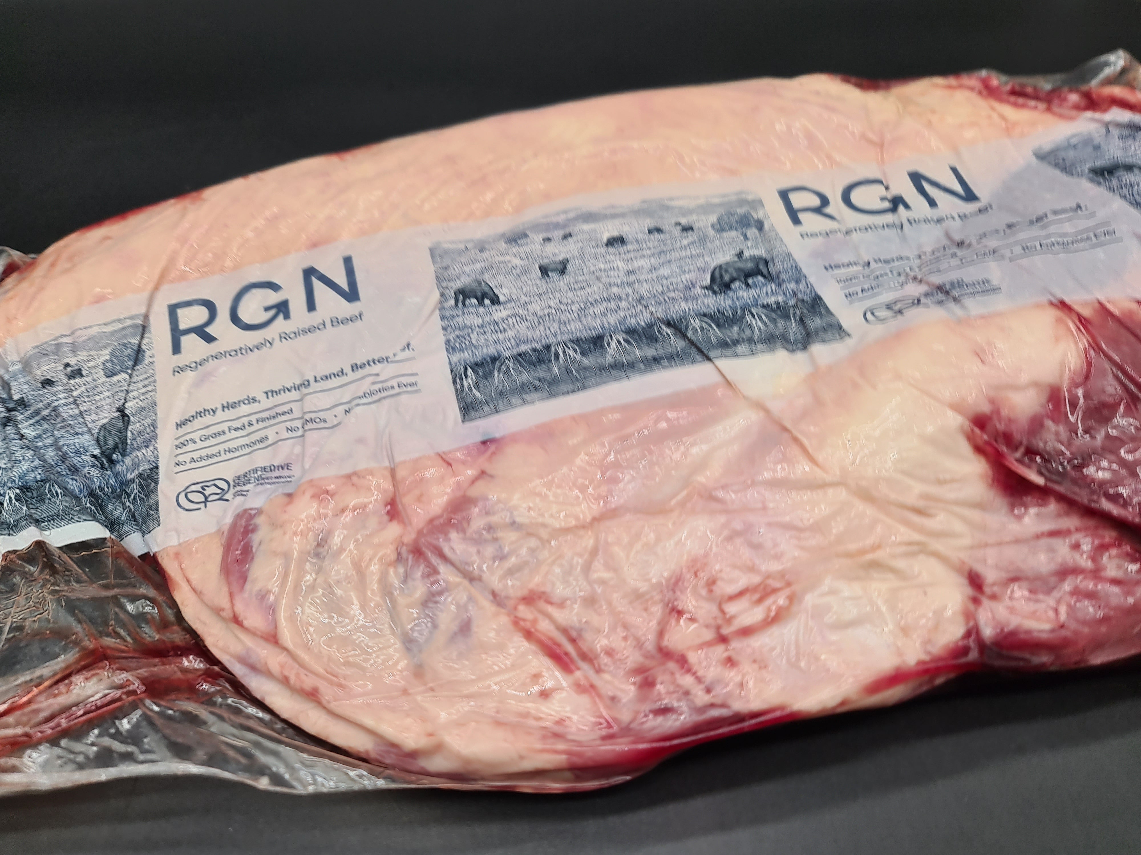 Two premium meat cuts side by side in vacuum packaging