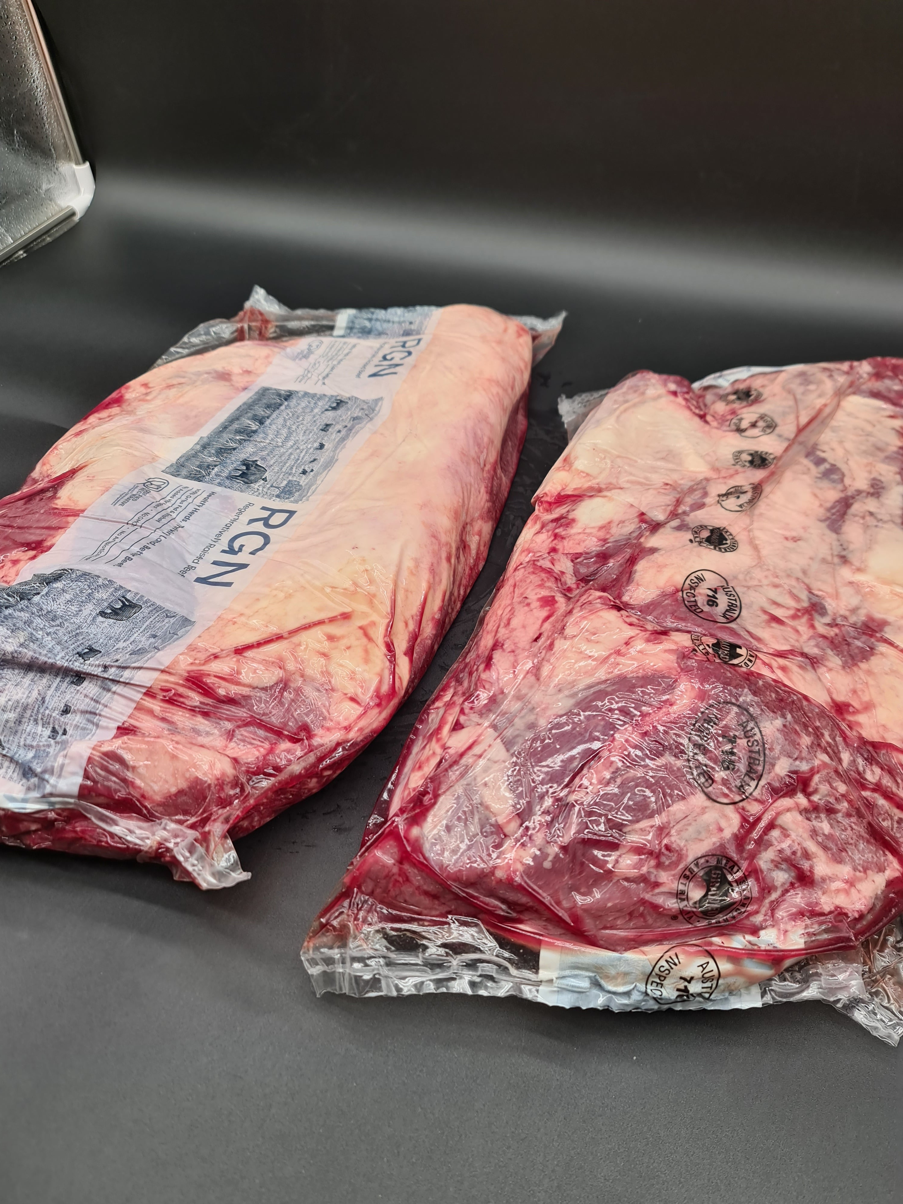 Angled view of premium meat cuts packed in an open box