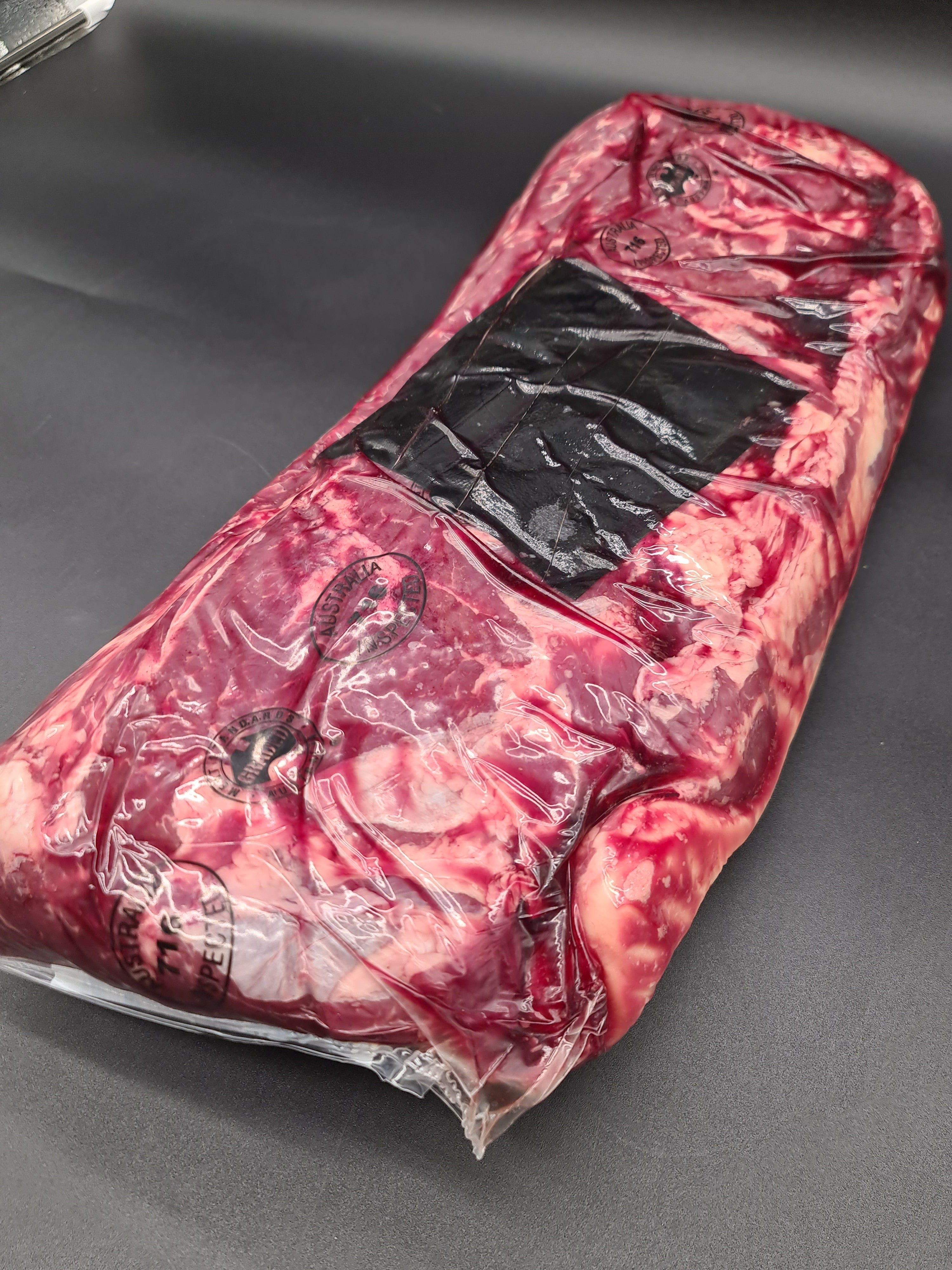 Top view of premium meat cuts packed inside an open box