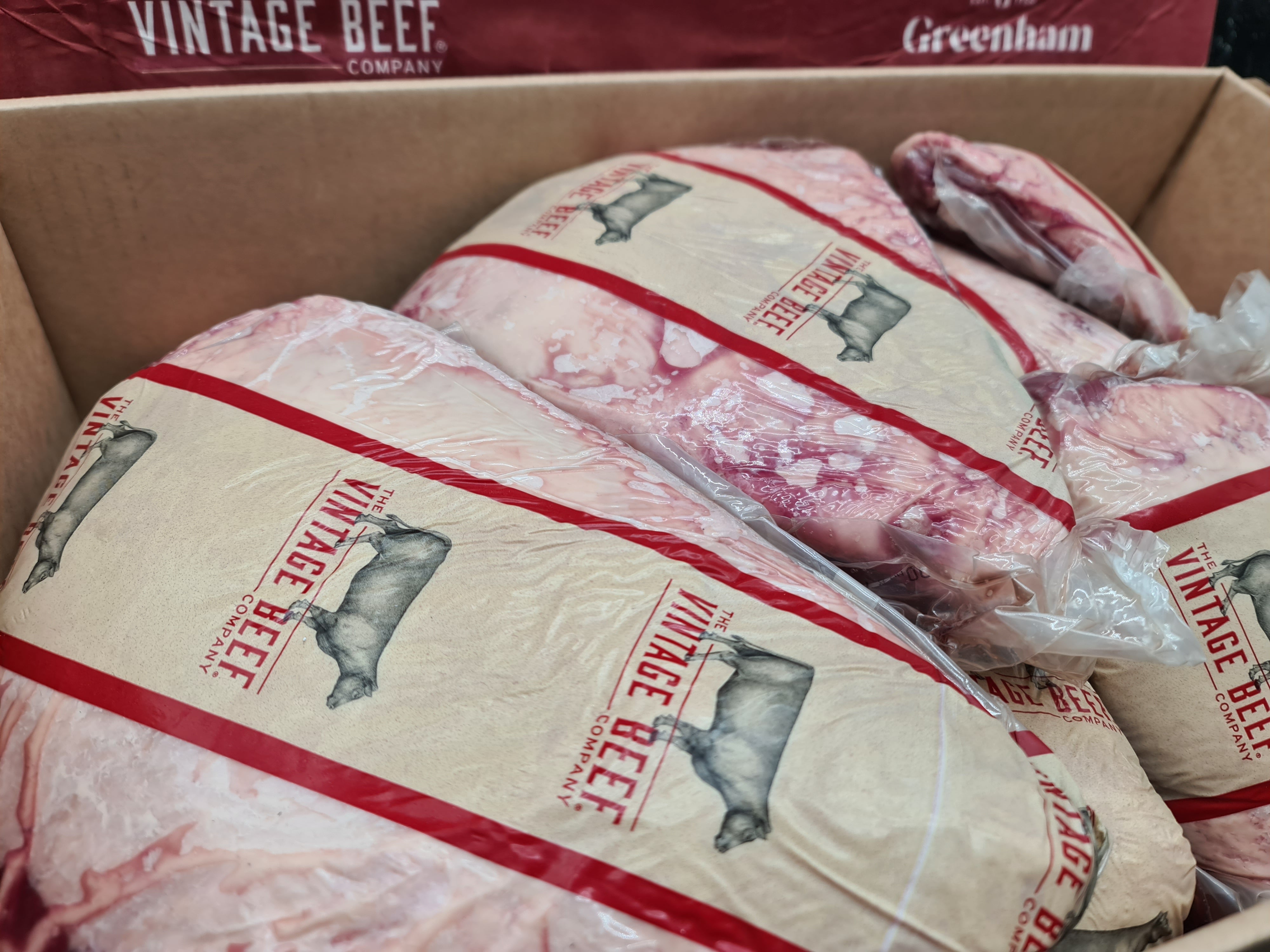 Close-up of two premium meat cuts with visible fat caps