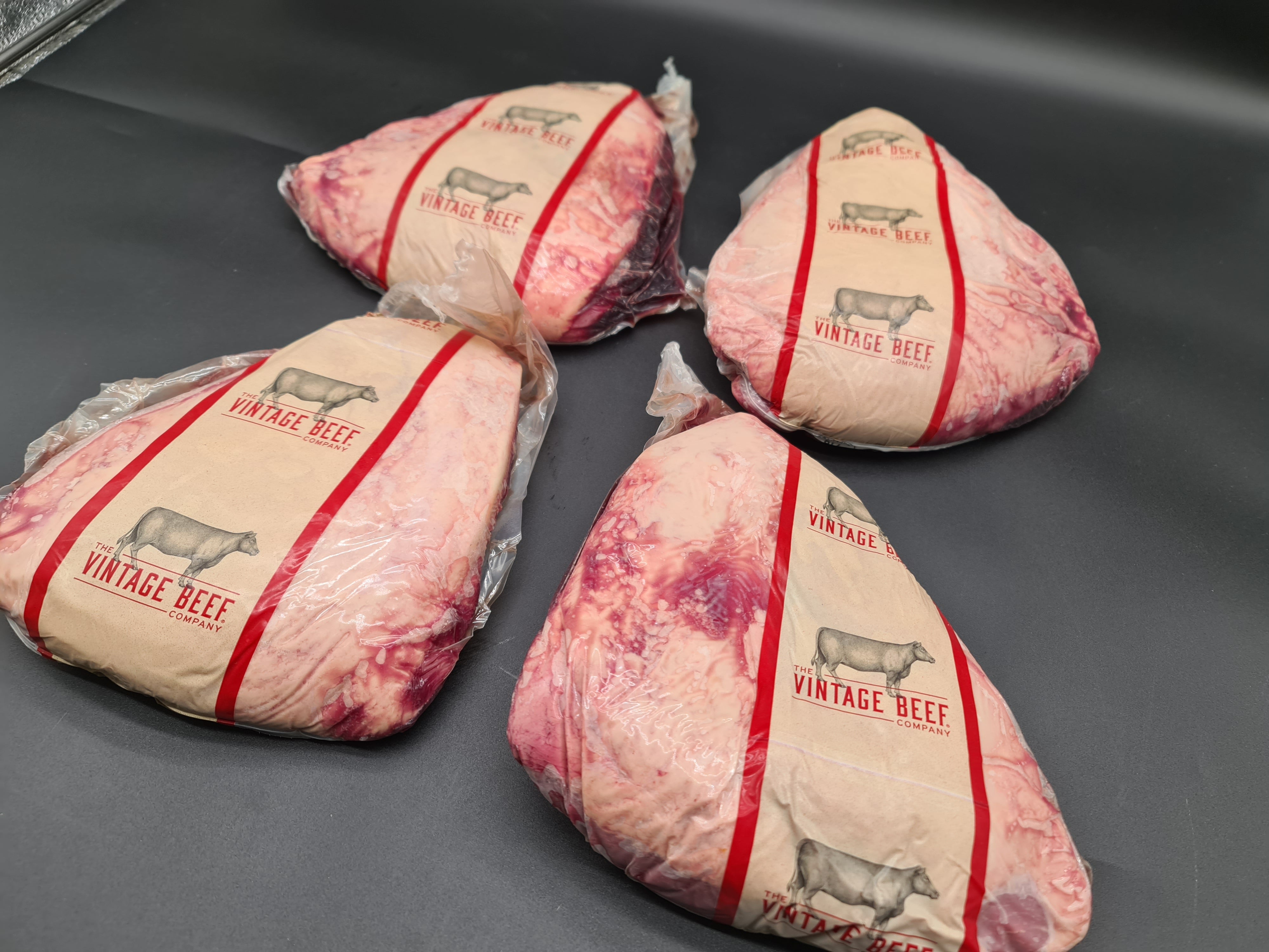 Open premium meat box with vacuum-packed cuts inside
