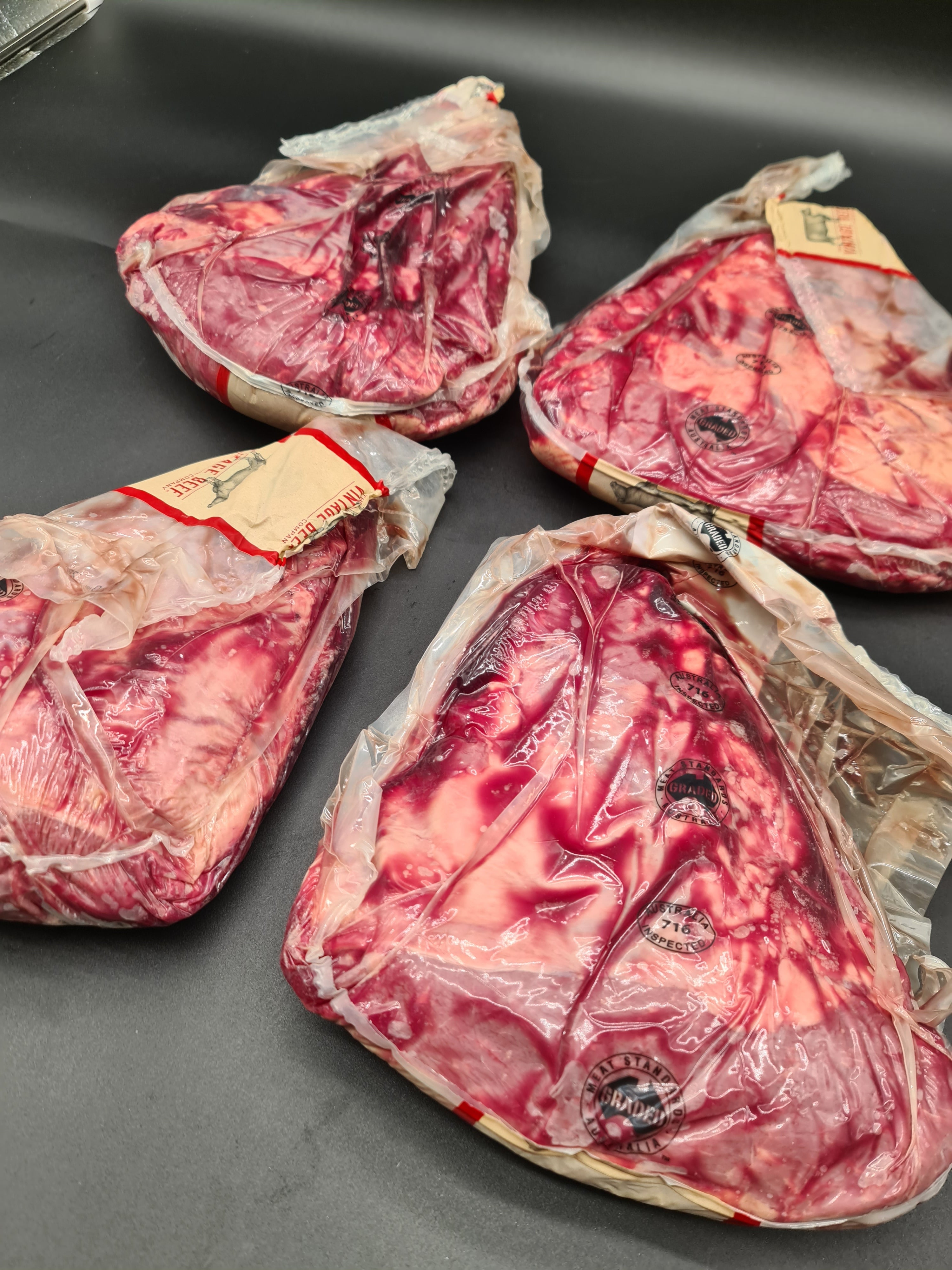 Two premium meat cuts side by side in packaging