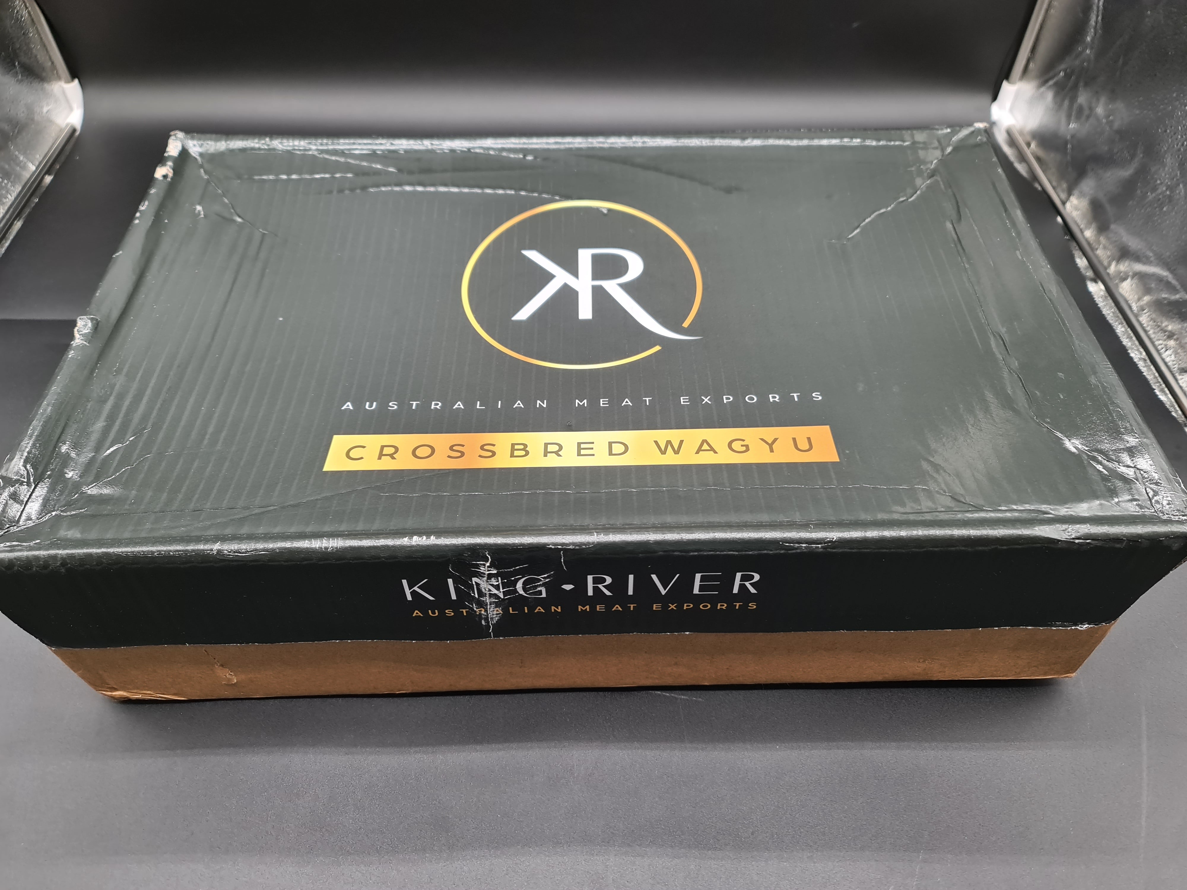 Open box showing premium meat cuts packed for delivery
