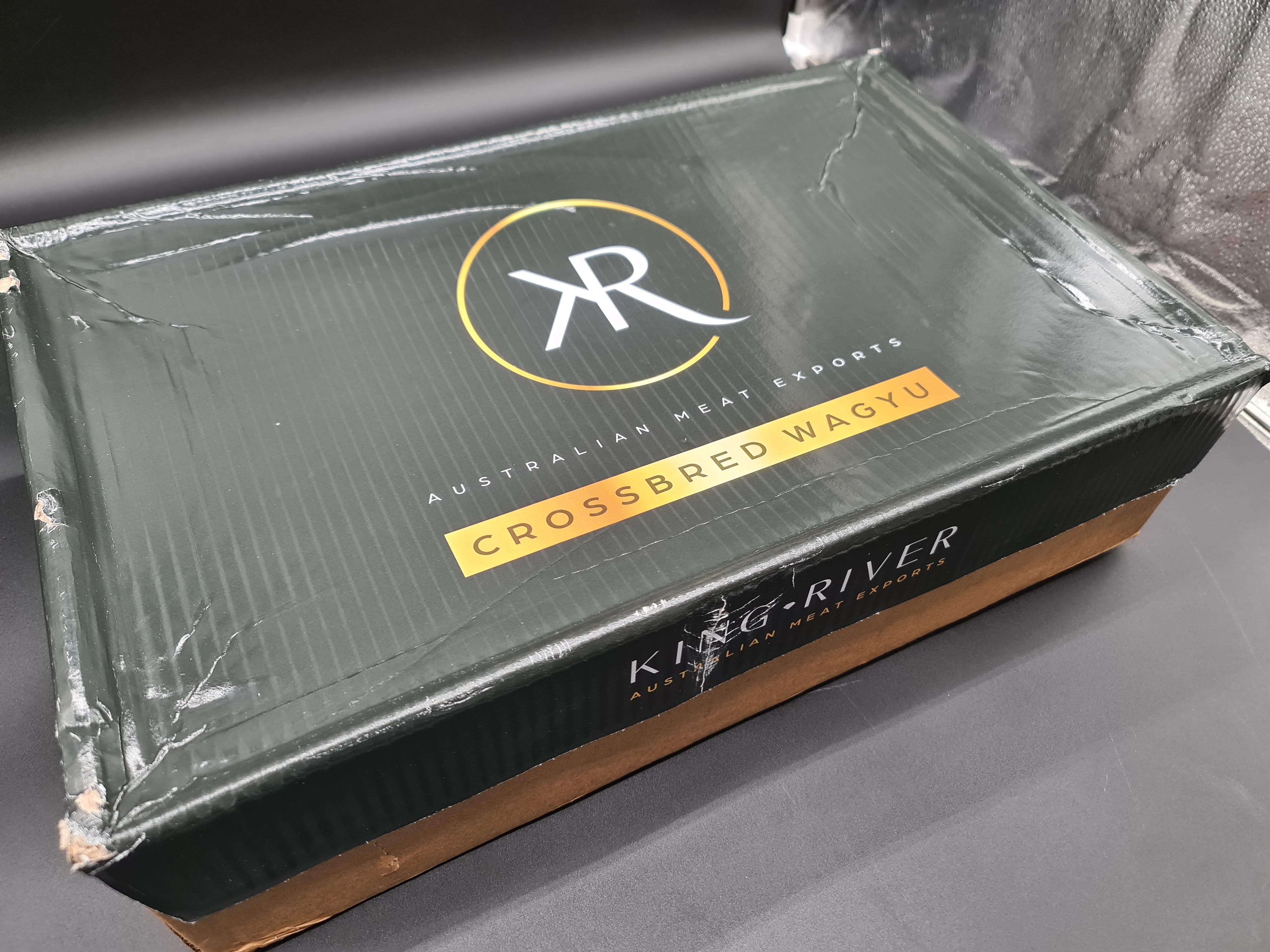 Top view of premium meat cuts in an open box