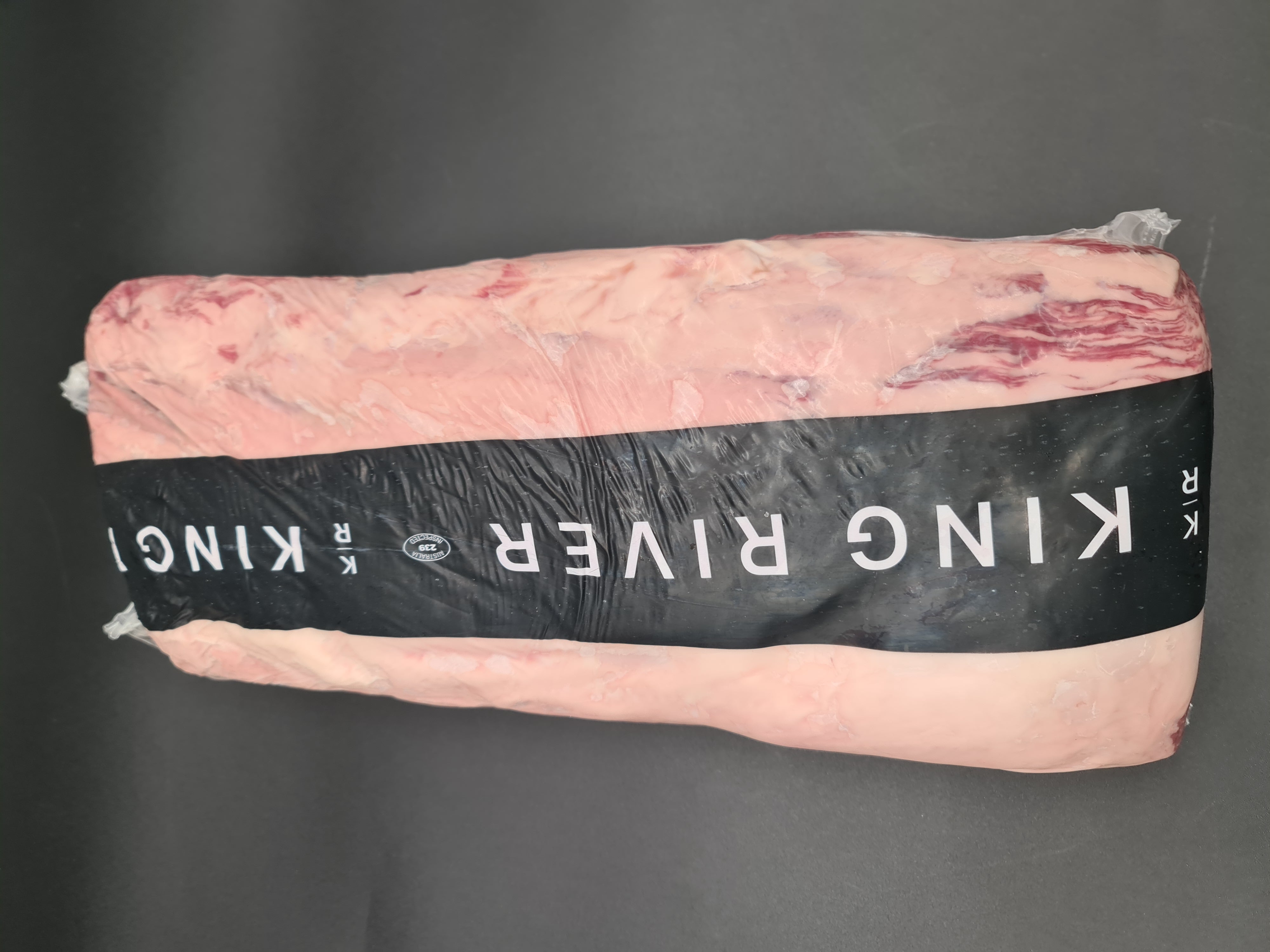 Open box filled with vacuum-packed premium meat cuts