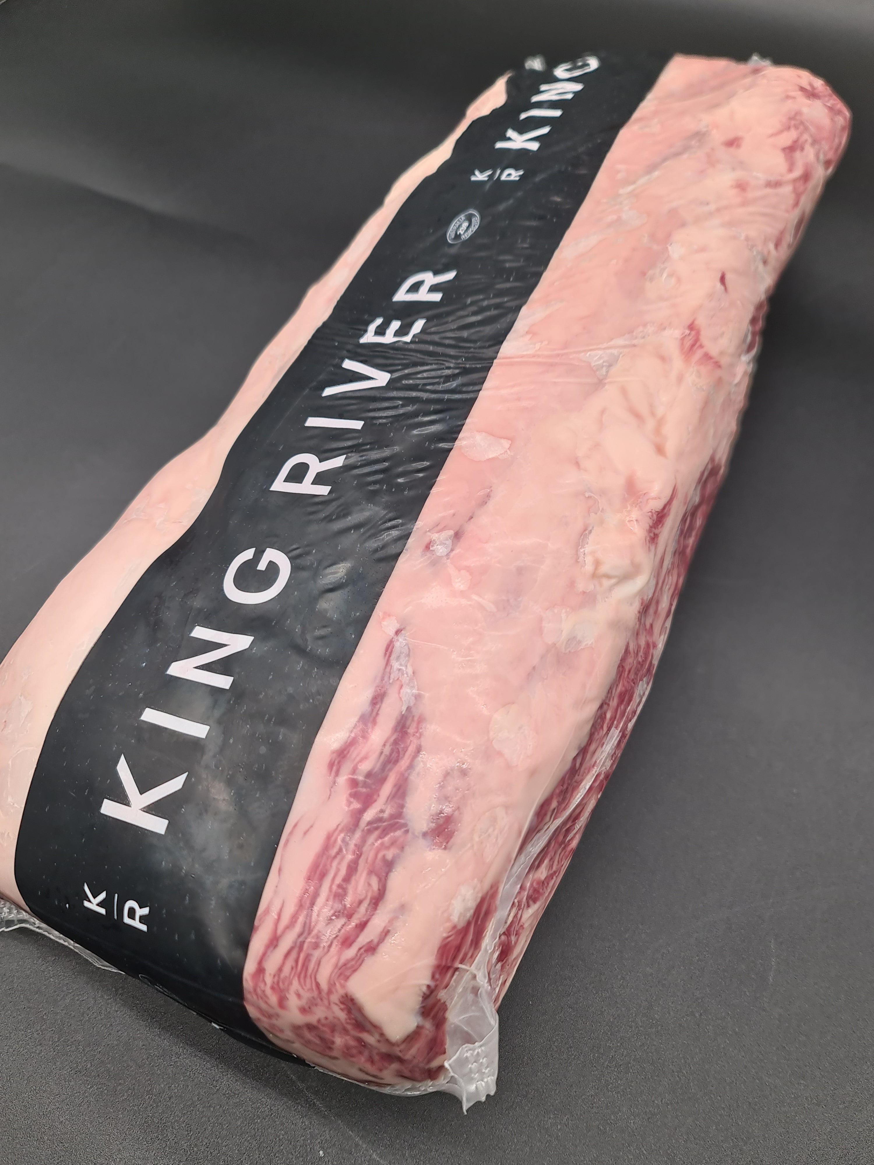 Top view of premium meat cuts packed inside an open box