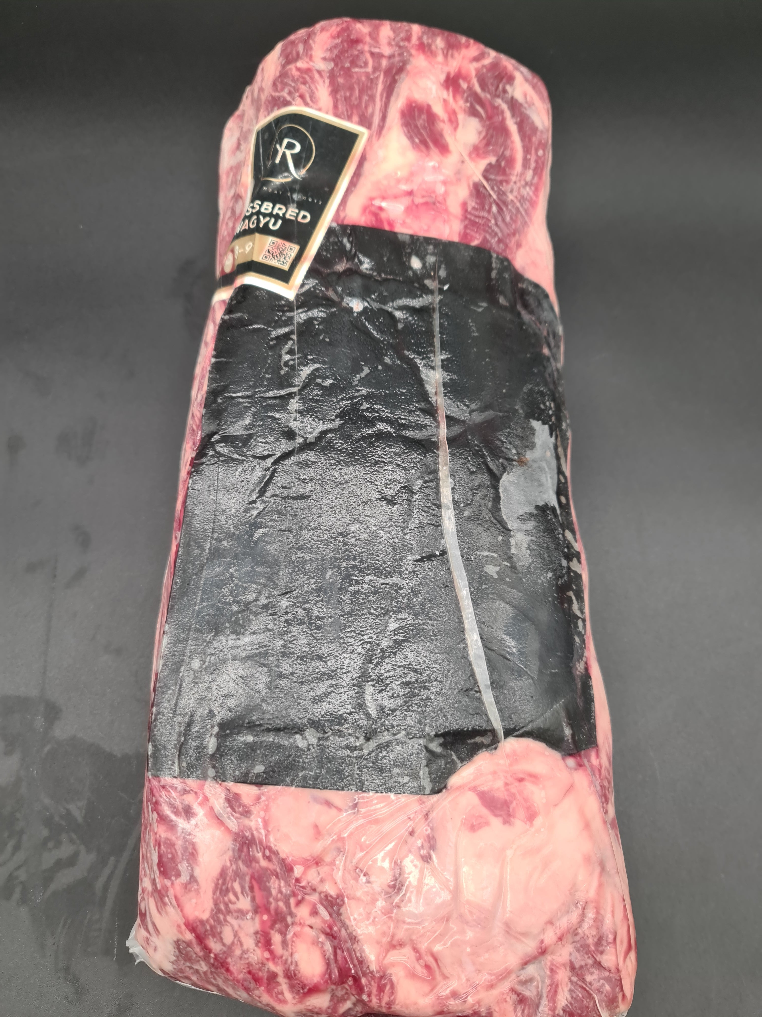 Vacuum-packed premium beef cut on a dark surface