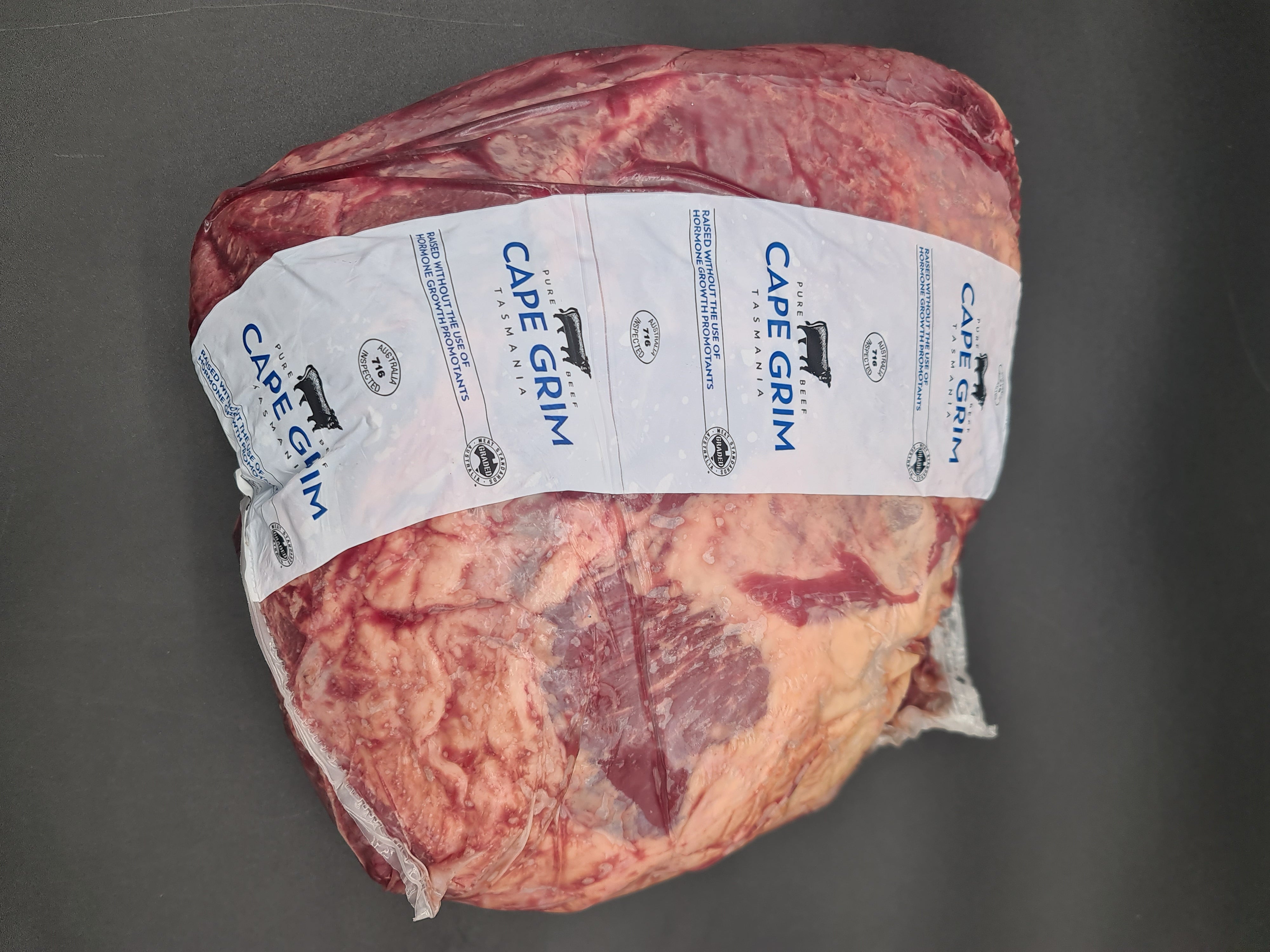 Vacuum-packed premium meat cut on a dark surface
