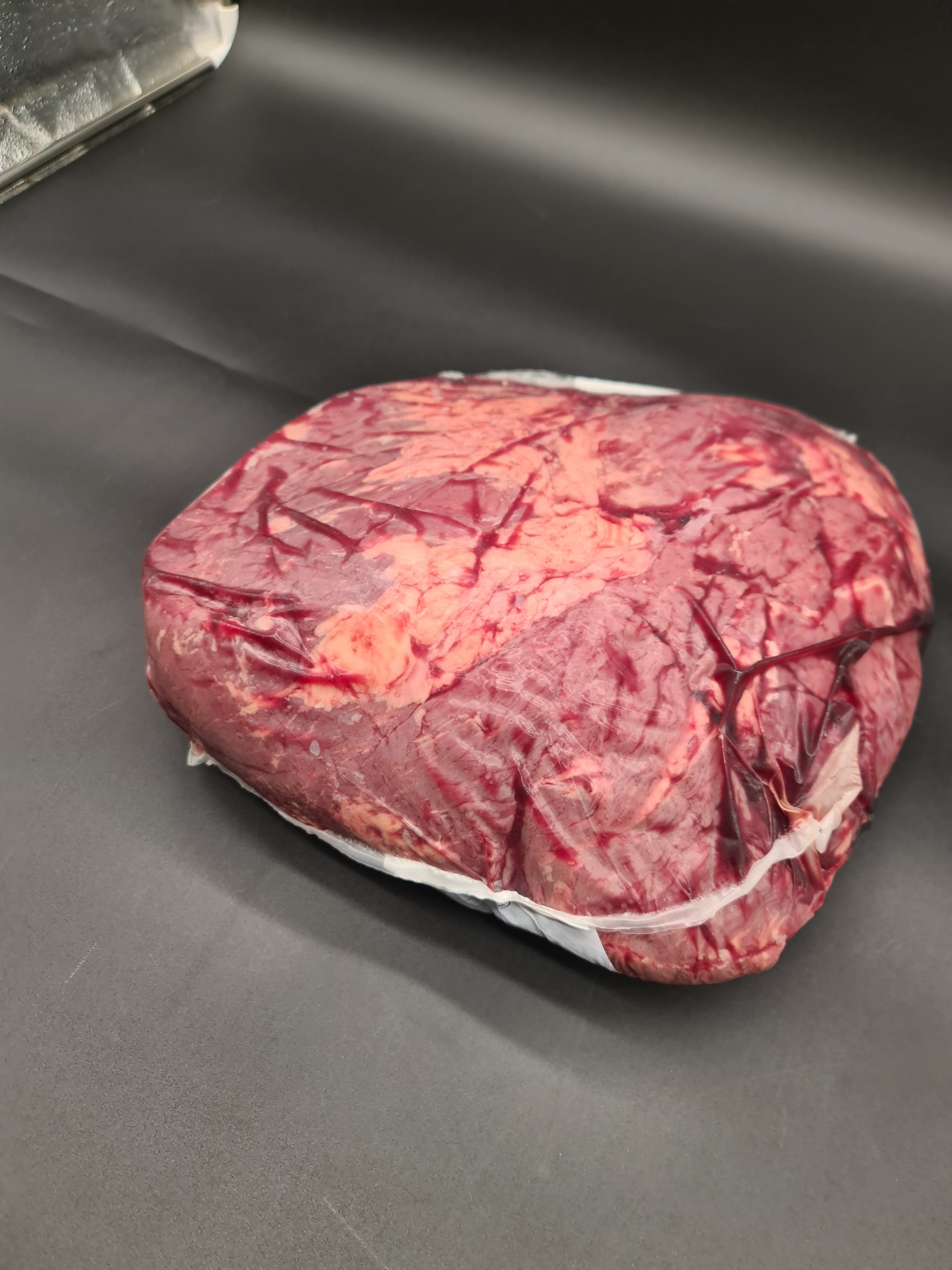 Top view of premium meat cuts packed inside an open box