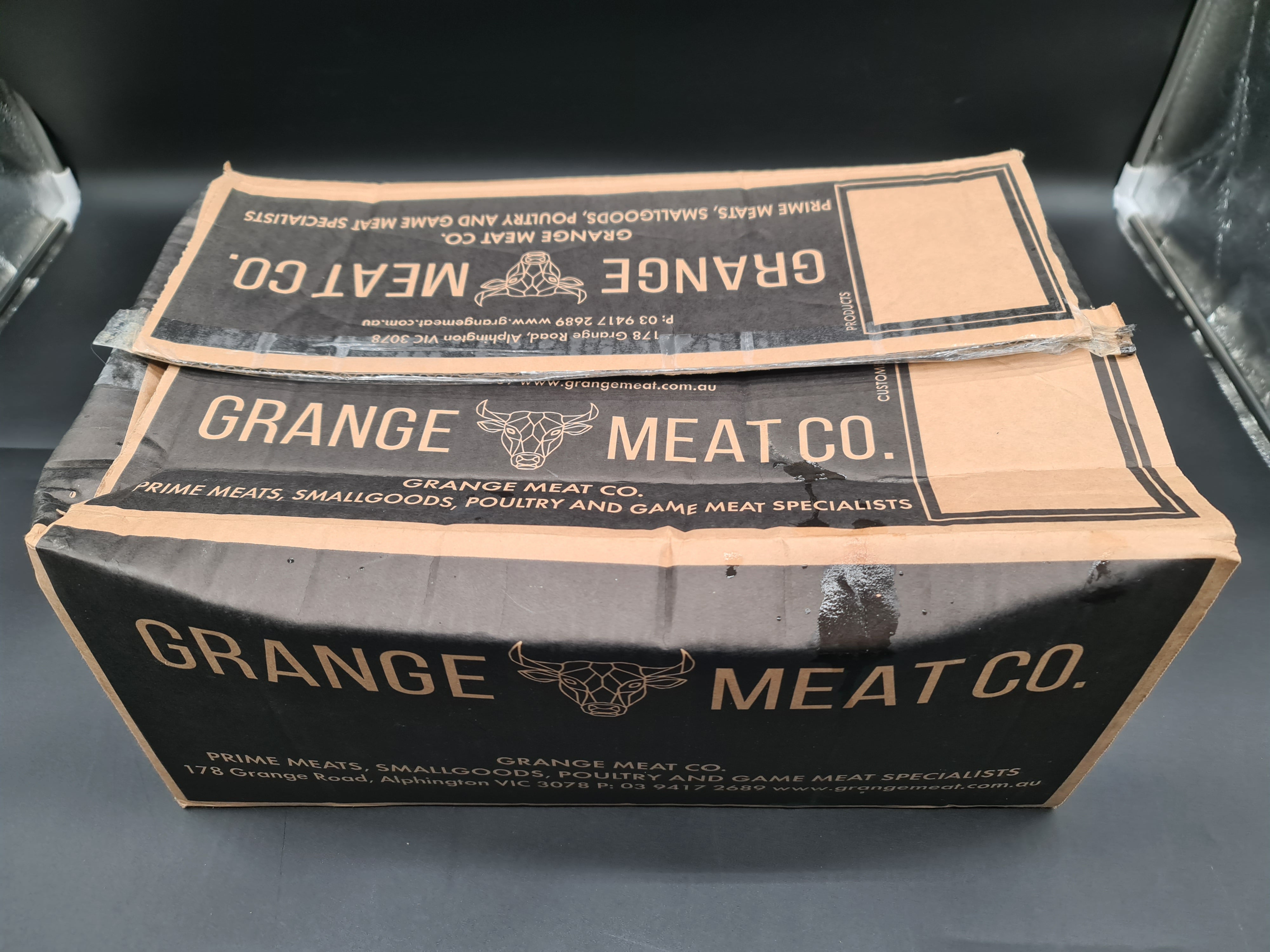 Vacuum-packed premium meat cut on a dark surface