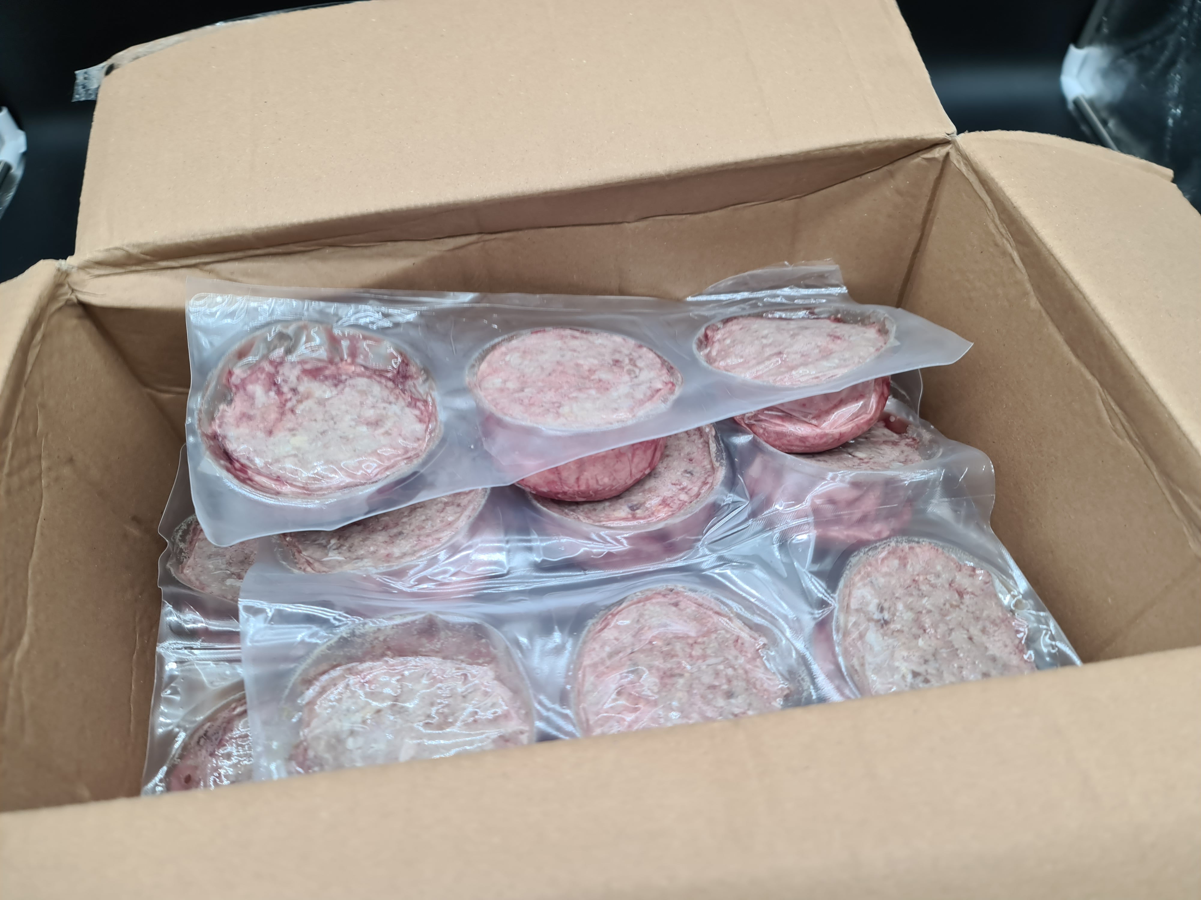 Two premium meat cuts side by side in vacuum packaging