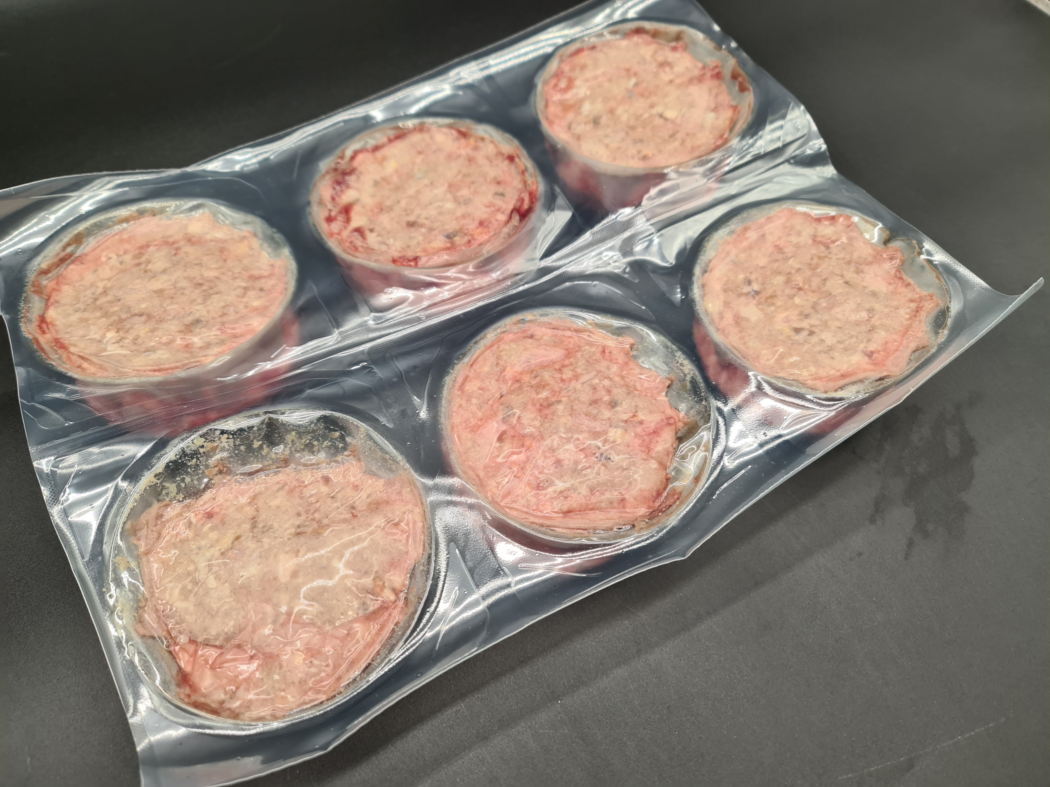 Top view of premium meat cuts packed inside an open box