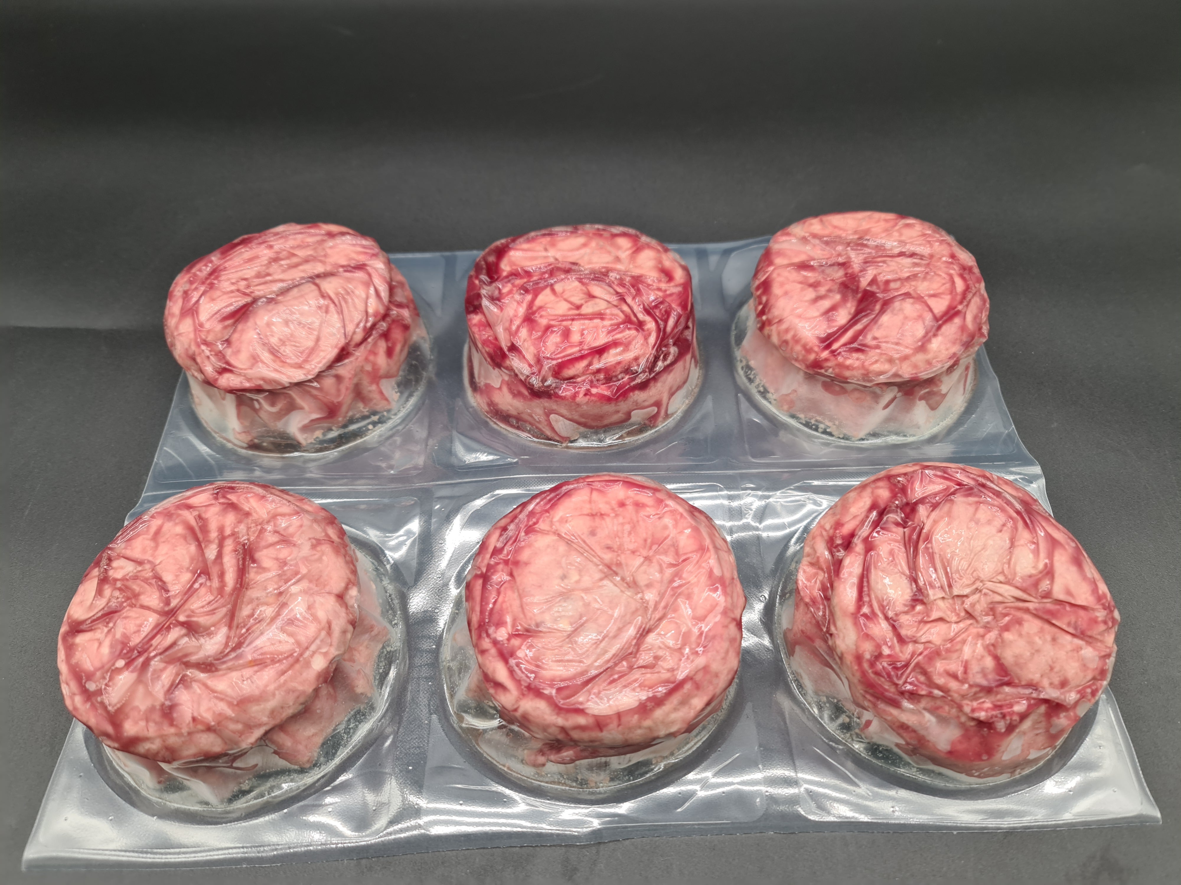 Angled view of packed premium meat cuts in a box