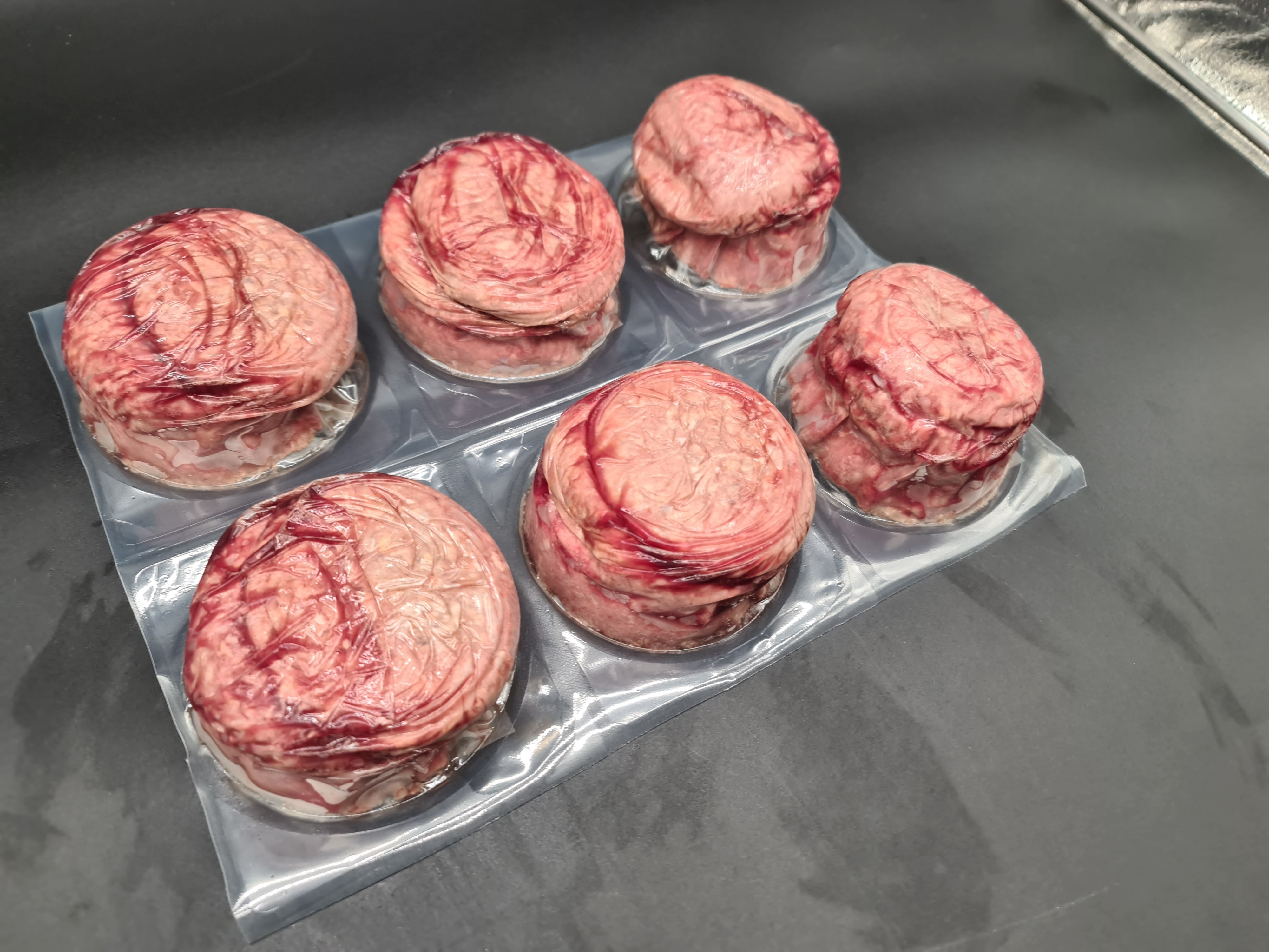 Top view of premium meat cuts packed inside an open box
