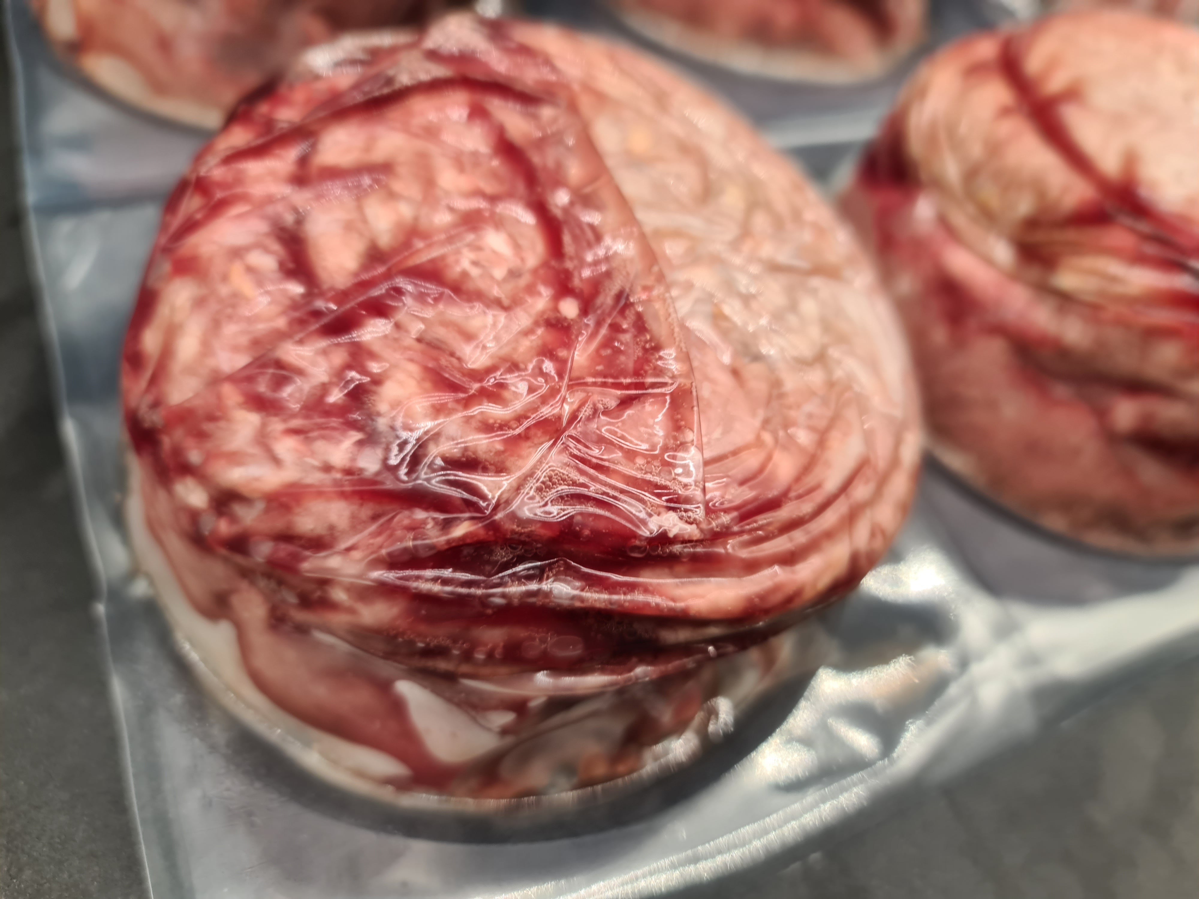 Angled view of packed premium meat cuts in a box