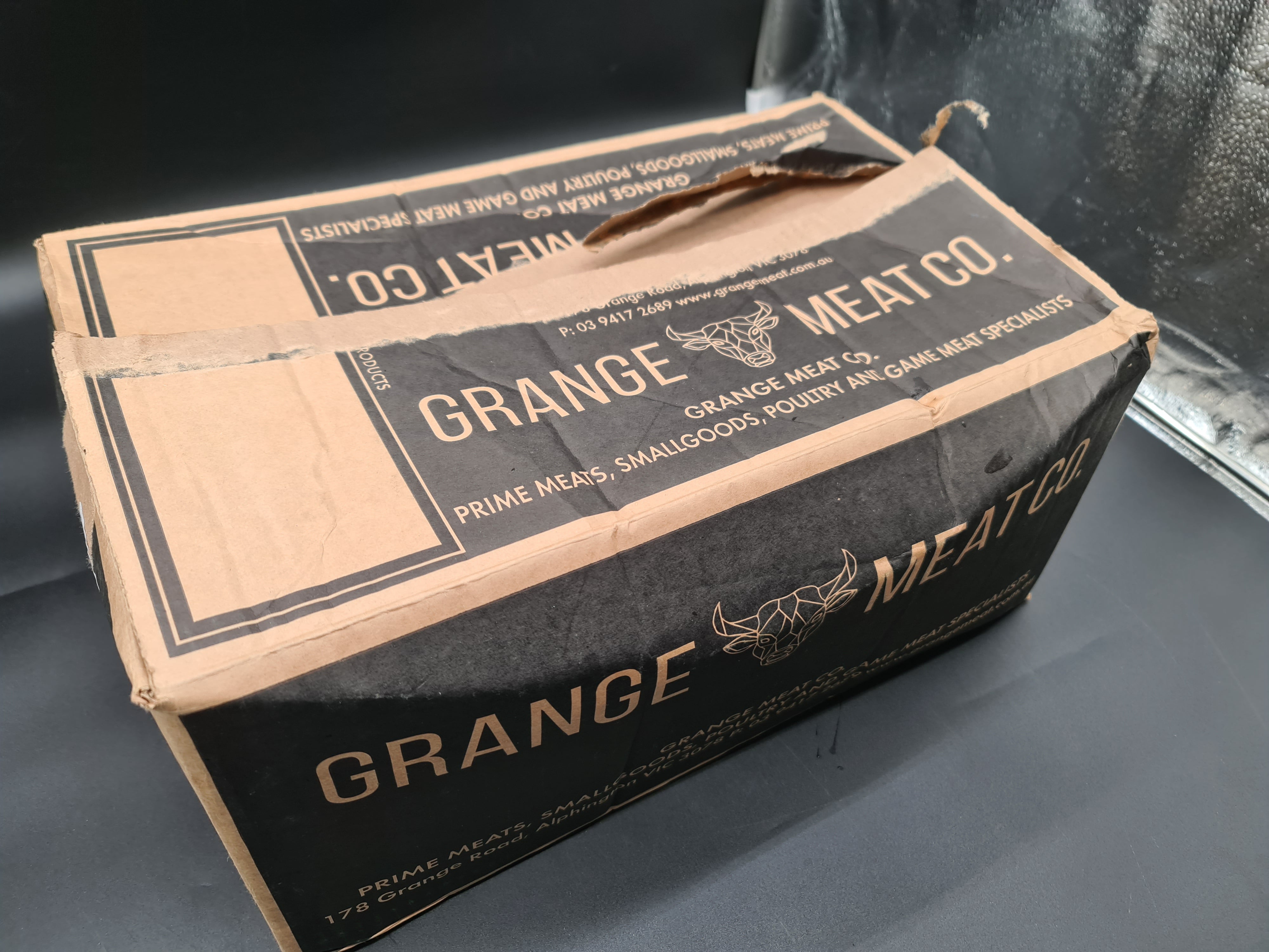 Angled view of a closed premium meat box