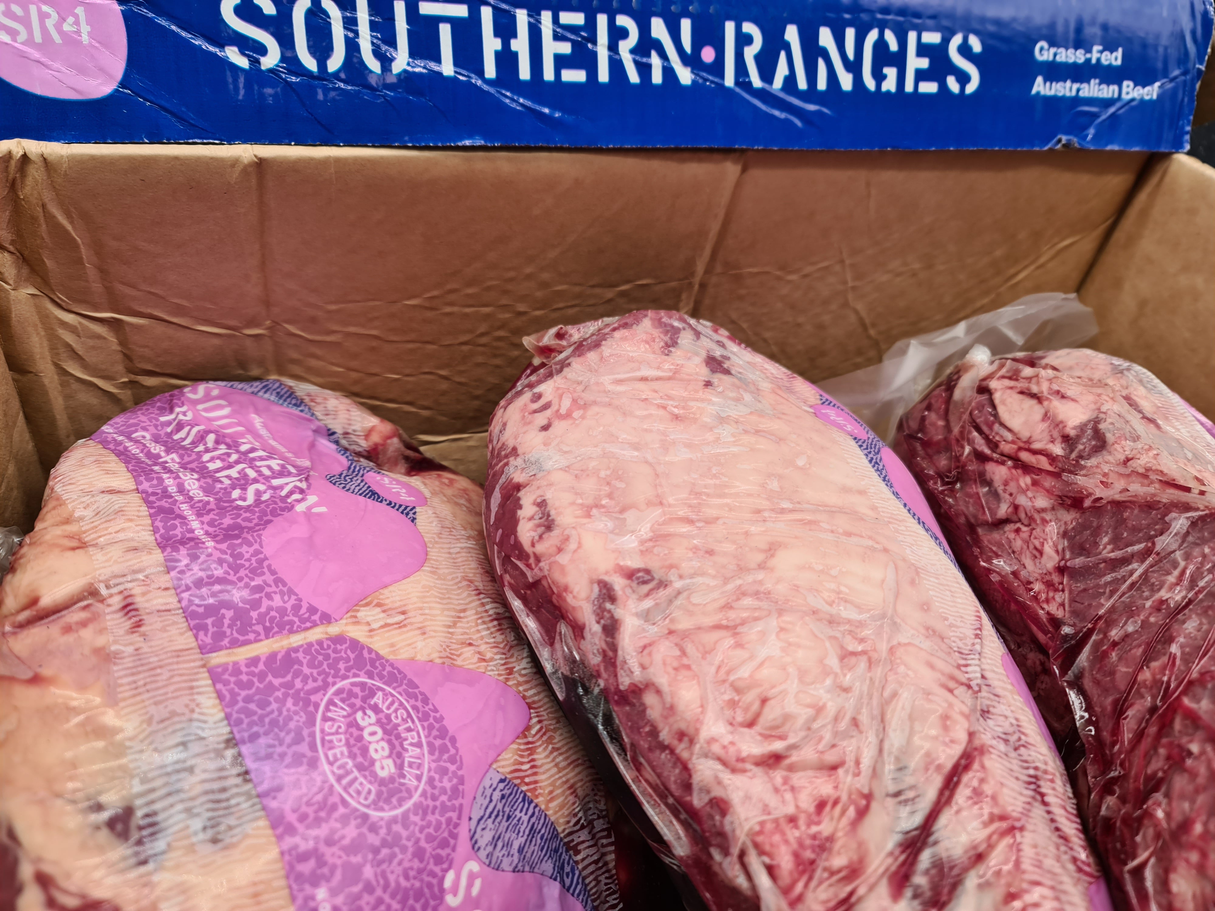 Vacuum-packed premium meat cut on a dark surface