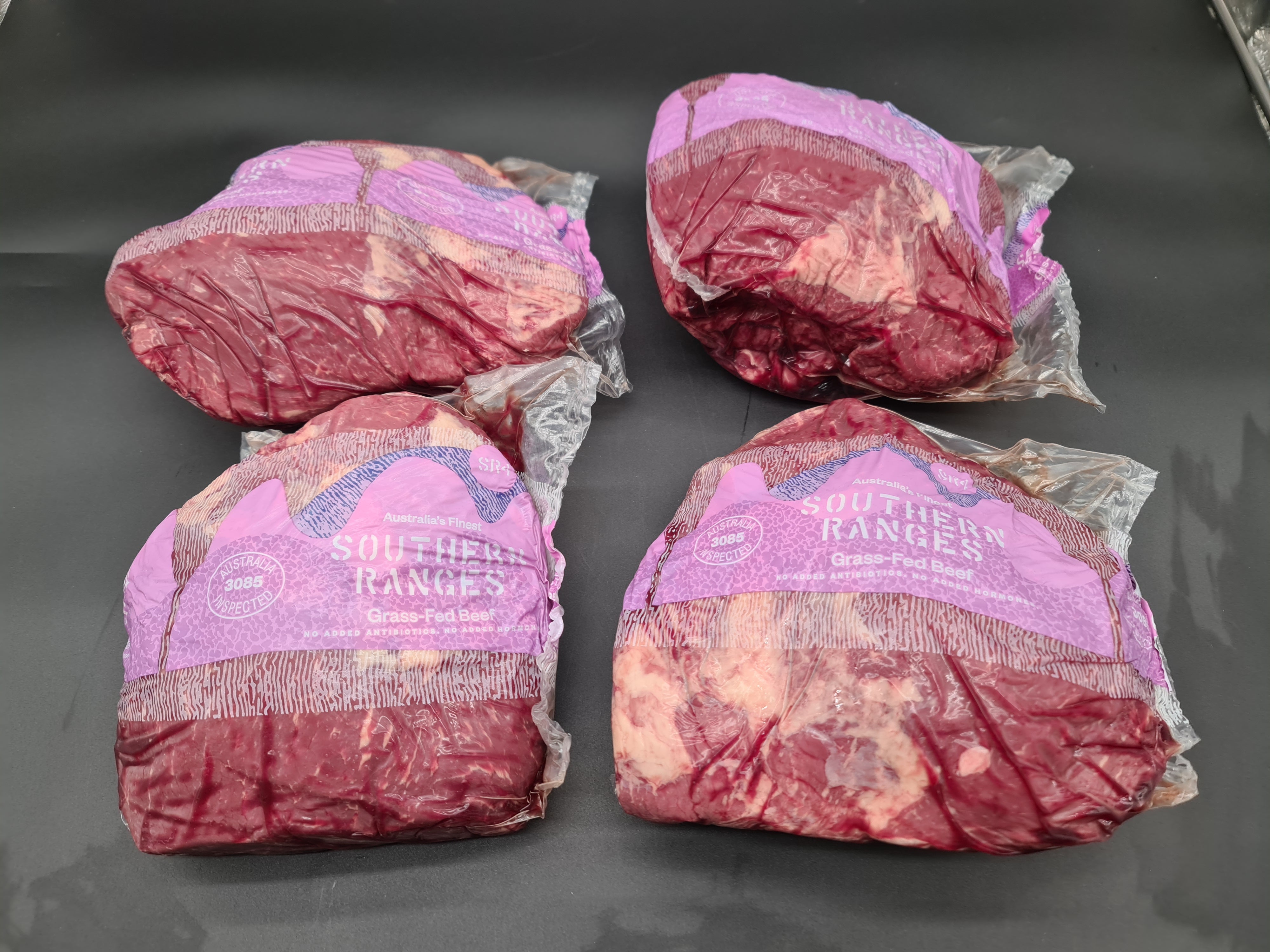 Vacuum-packed premium meat cut on a dark surface