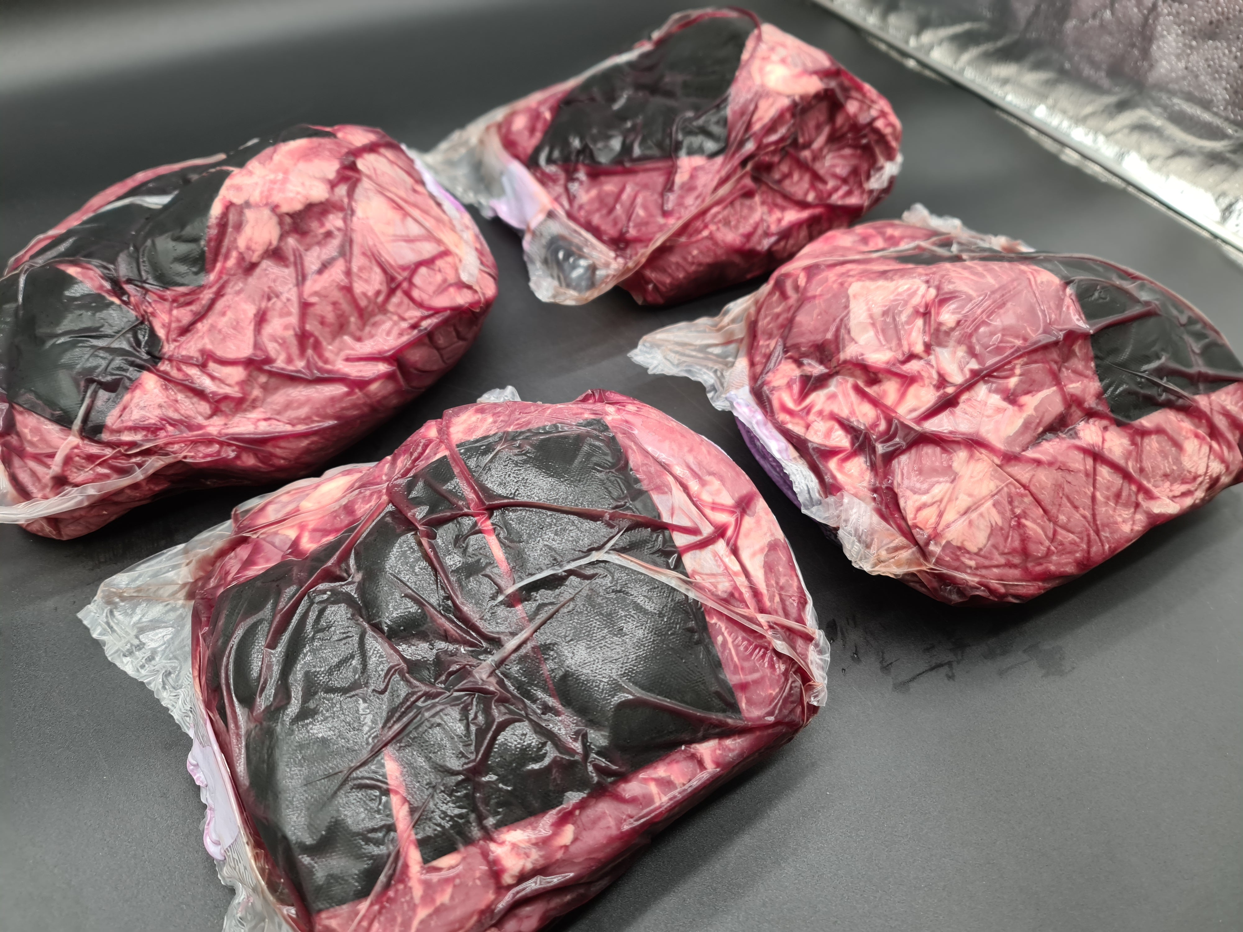 Angled premium meat cut showing lean meat and fat cap