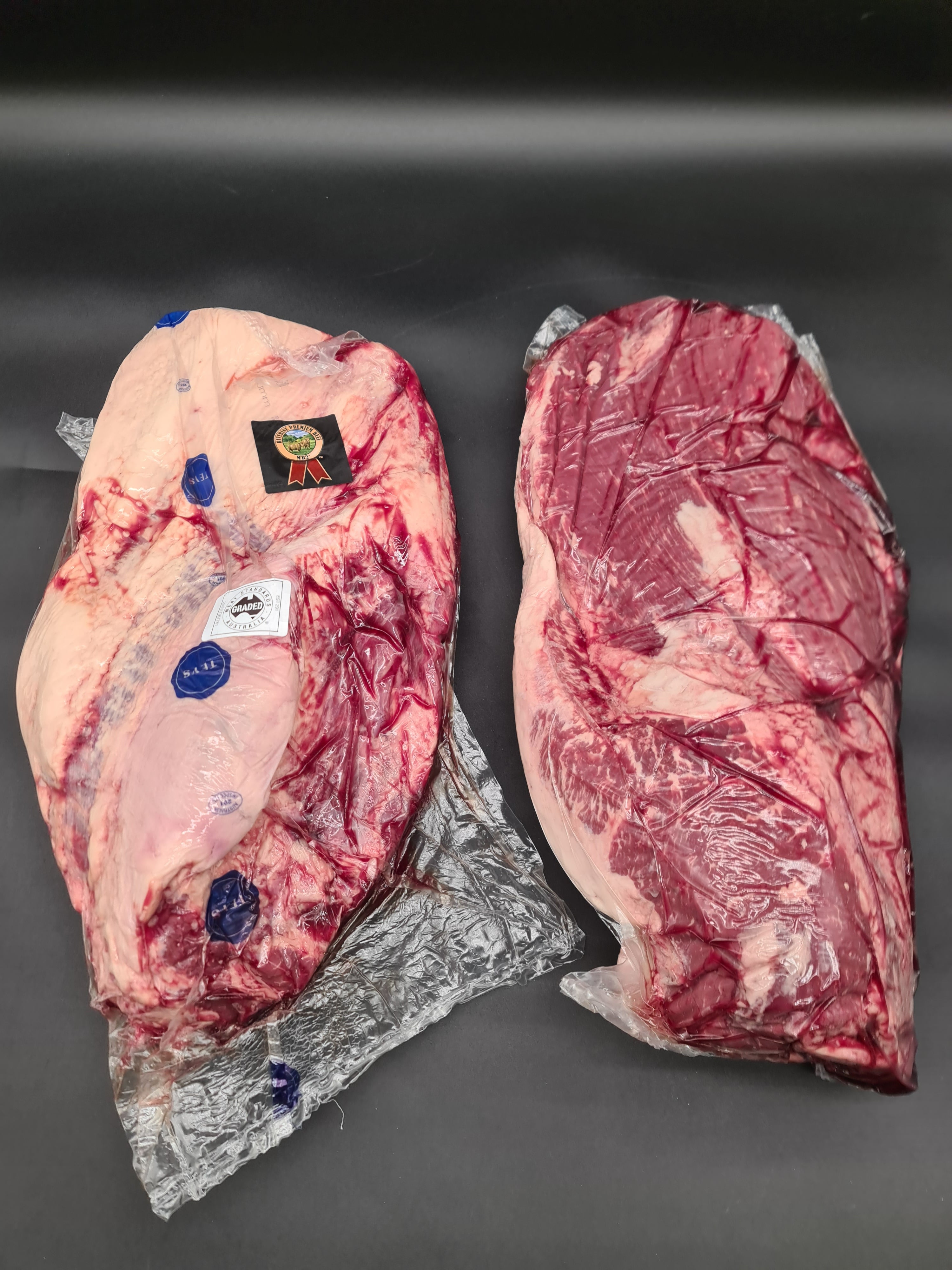 Close-up of premium meat cuts packed in an open box
