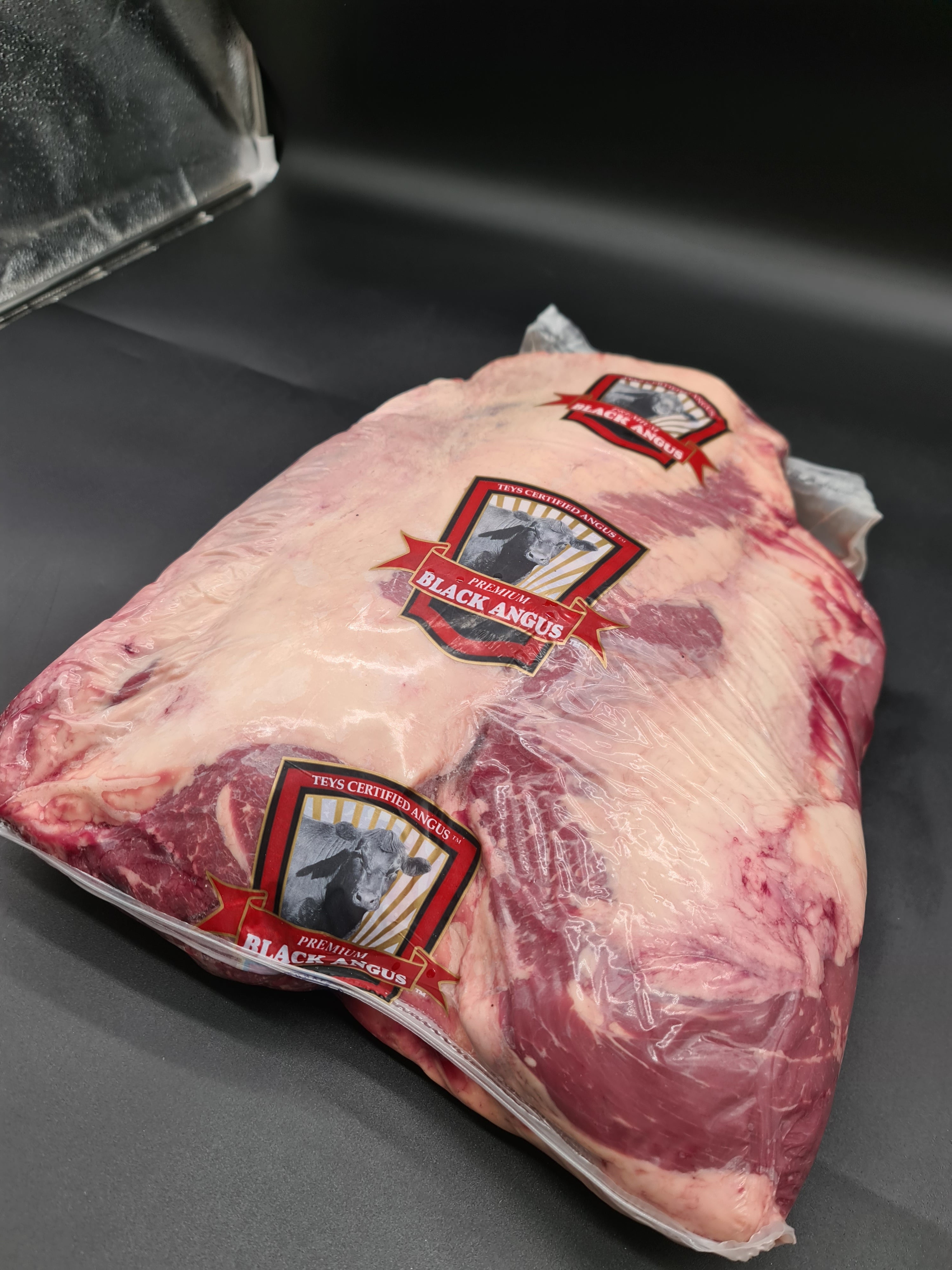 Angled premium meat cut showing lean meat and fat cap