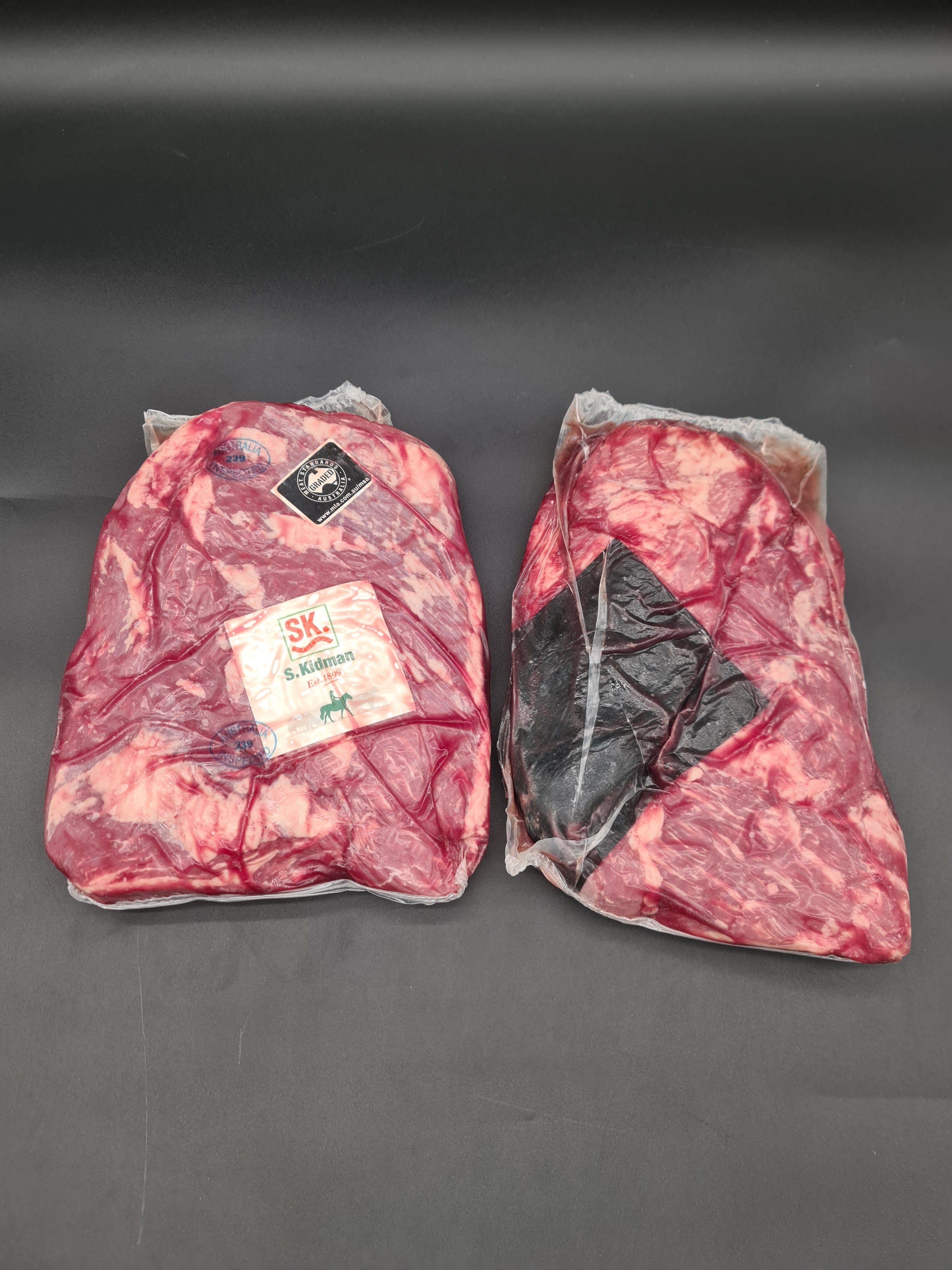 Closed premium meat box on a dark studio surface