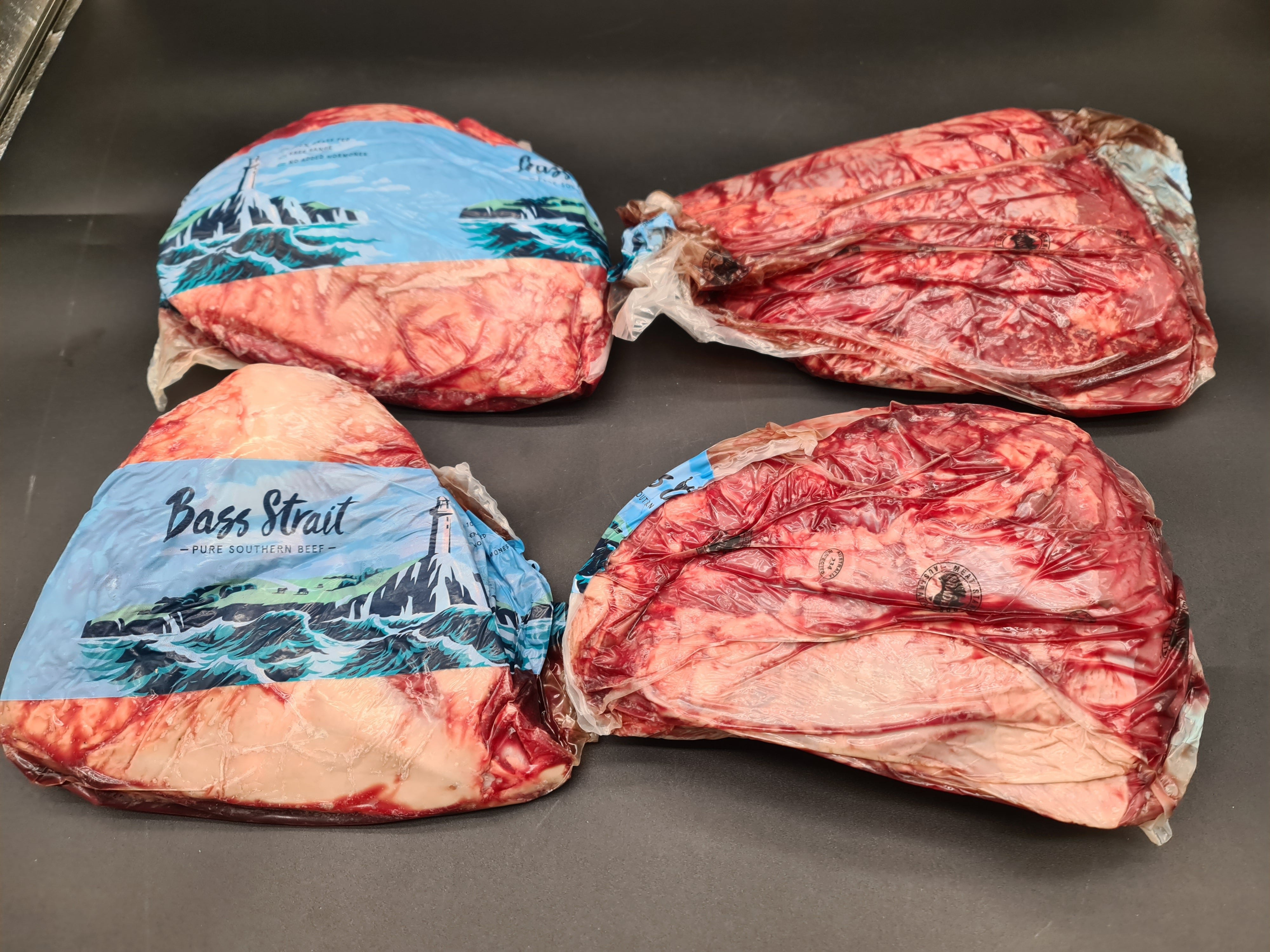 Vacuum-packed premium meat cut on a dark surface
