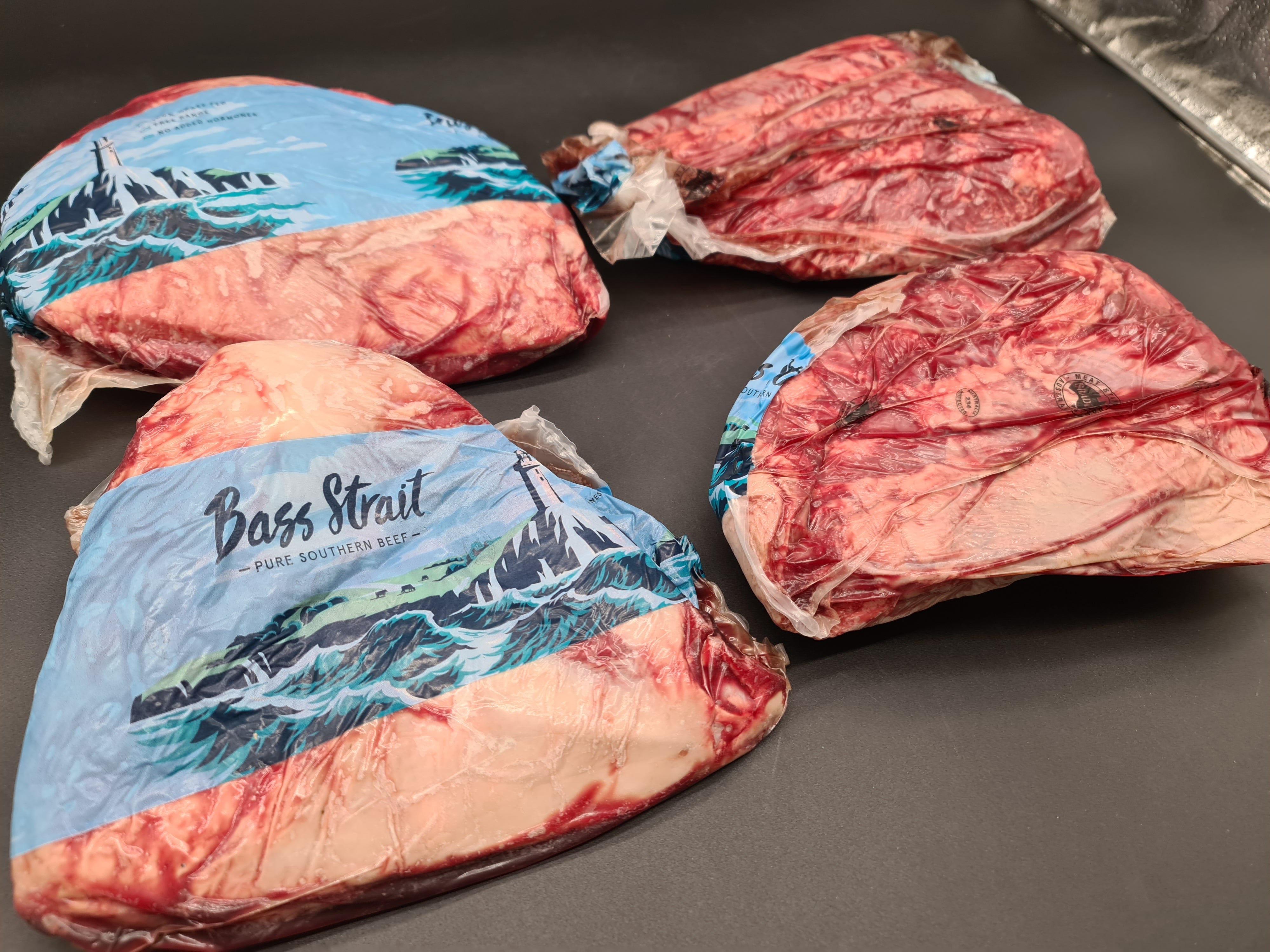 Close-up of premium meat cuts packed in an open box