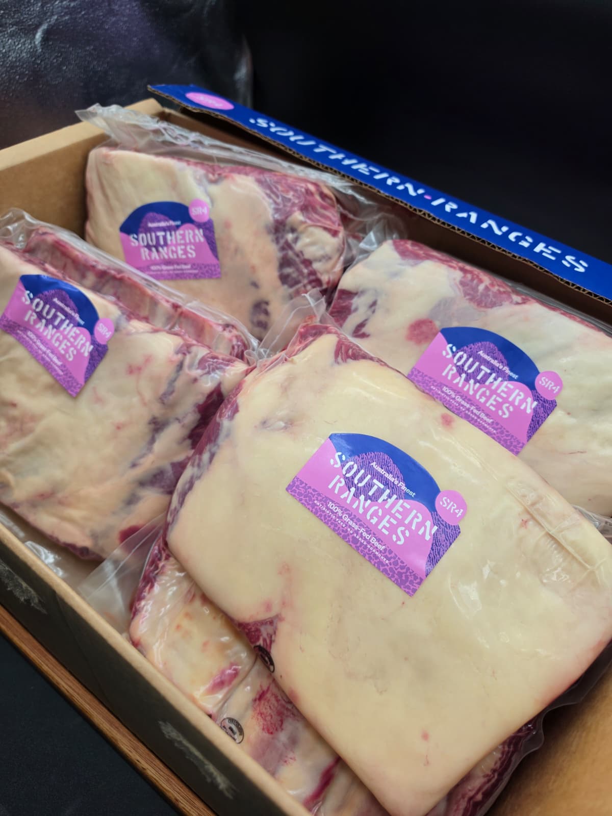 Grass-fed short ribs showing MB4+ marbling and fat cover
